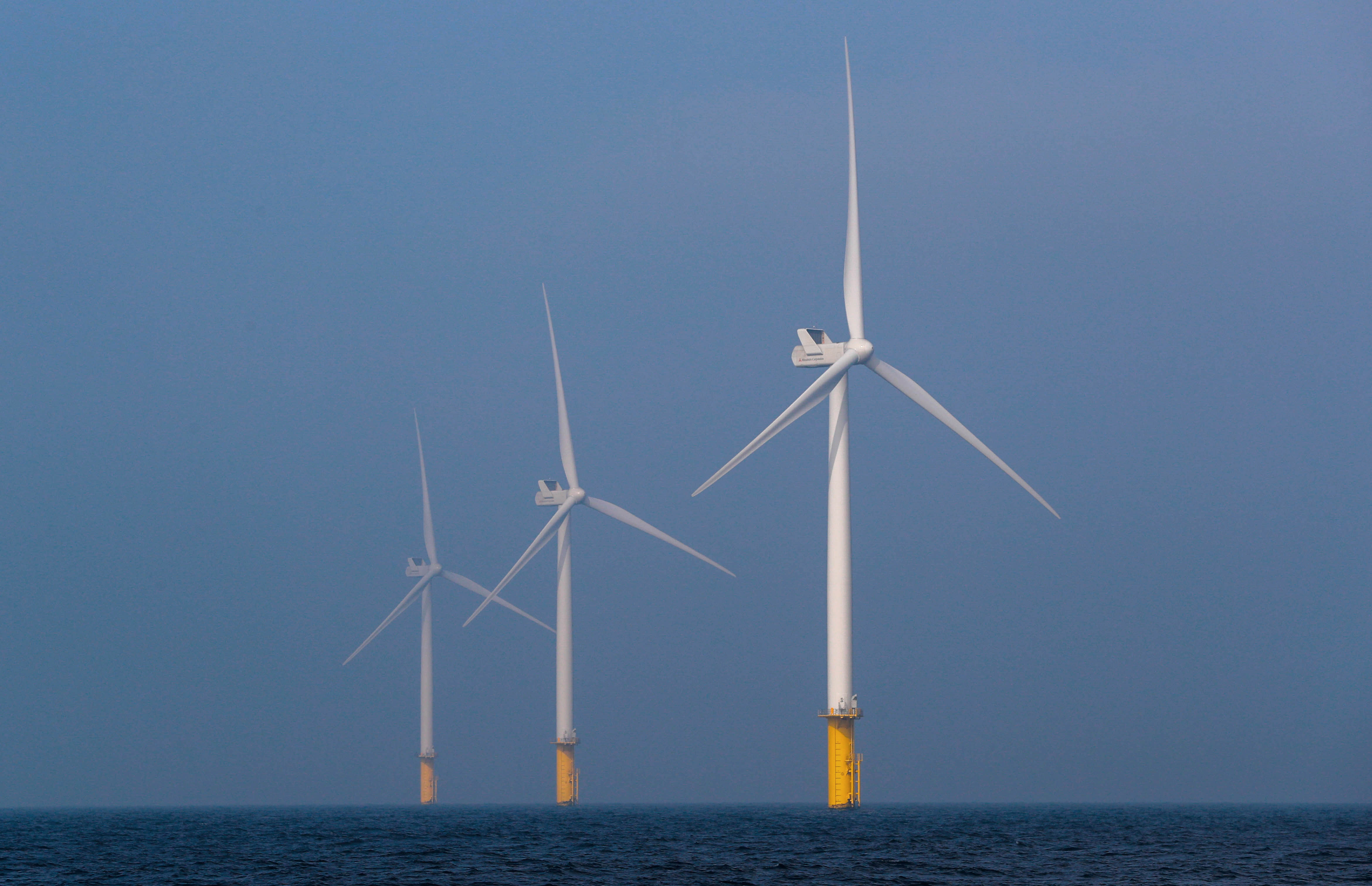 Power-generating windmill turbines are seen at the Eneco offshore Luchterduinen windfarm near Amsterdam