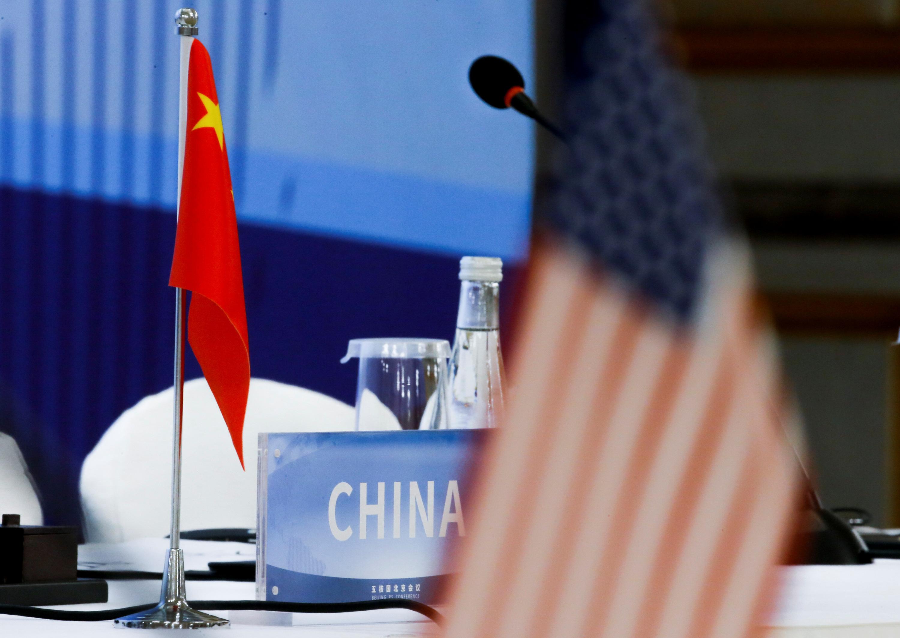 The Chinese and U.S. national flags are seen before the start of a P5 NPT conference in Beijing