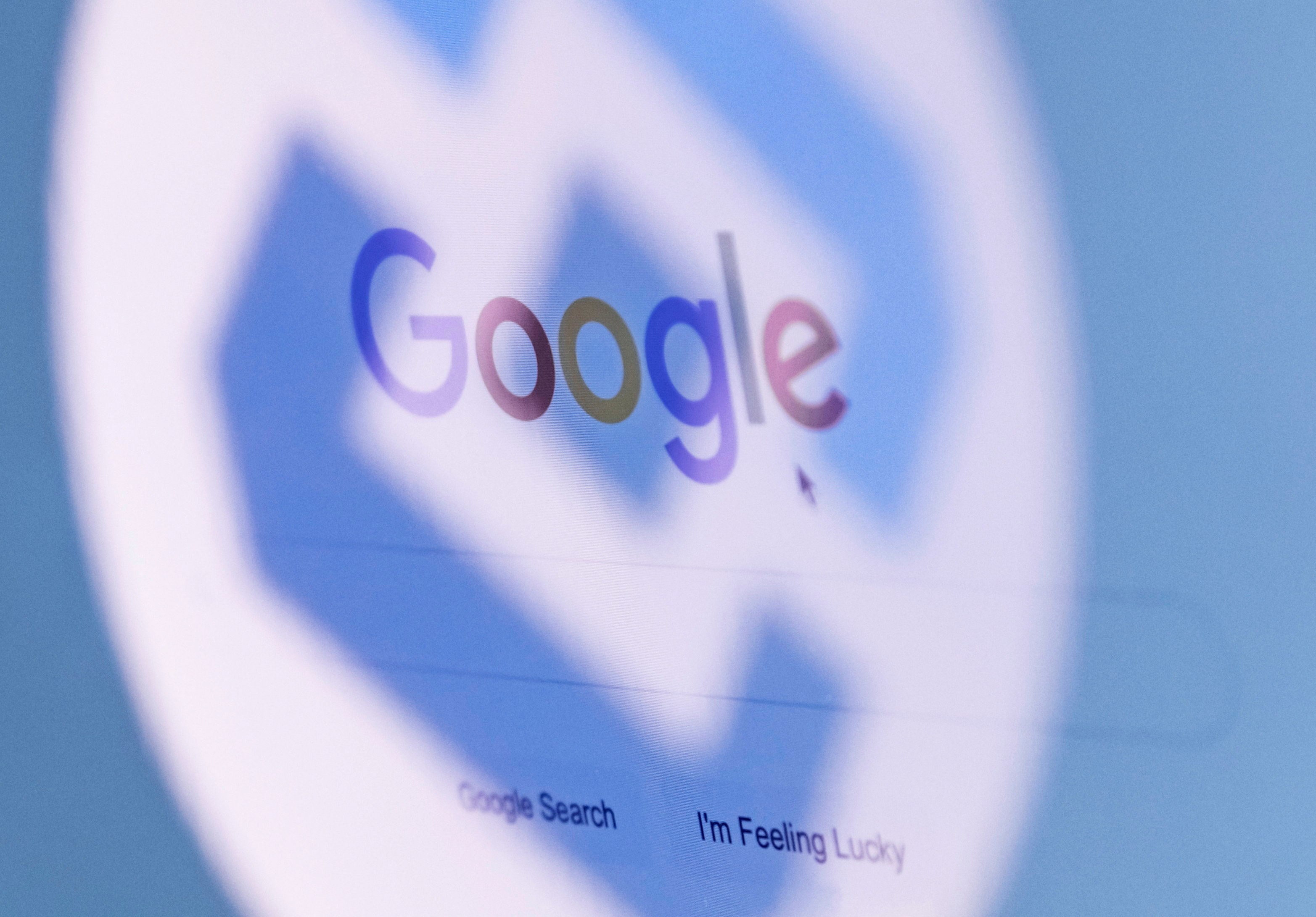 The logo of Russia's state communications regulator, Roskomnadzor, is reflected in a laptop screen showing Google start page in this picture illustration