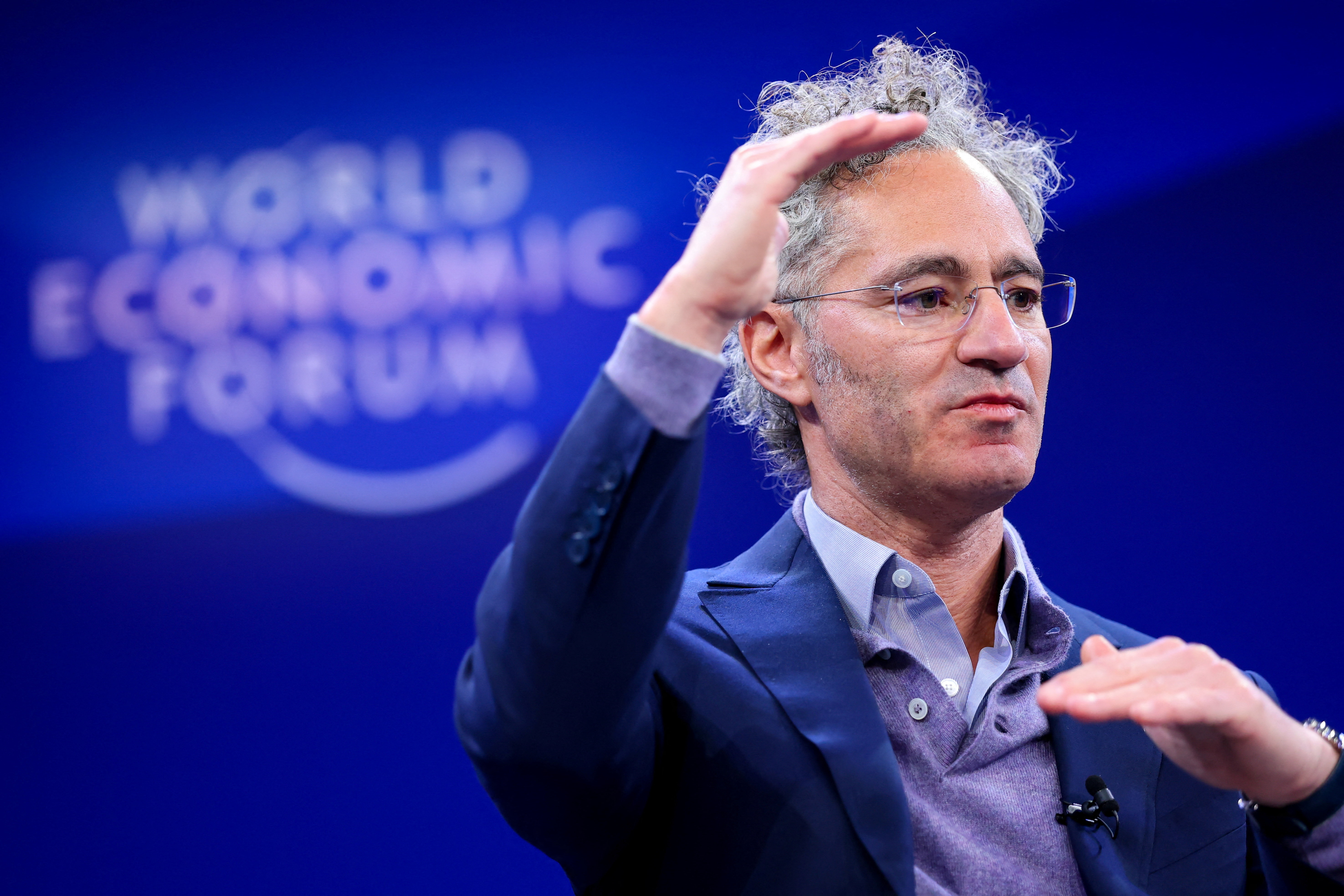 Palantir CEO defends surveillance tech as US government contracts boost sales | Reuters