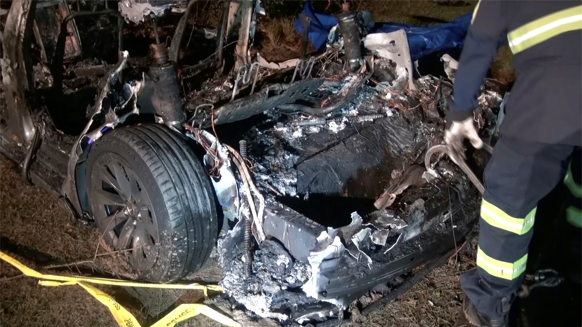 The remains of a Tesla vehicle are seen after it crashed in The Woodlands, Texas, April 17, 2021, in this still image from video obtained via social media. Video taken April 17, 2021. SCOTT J. ENGLE via REUTERS 