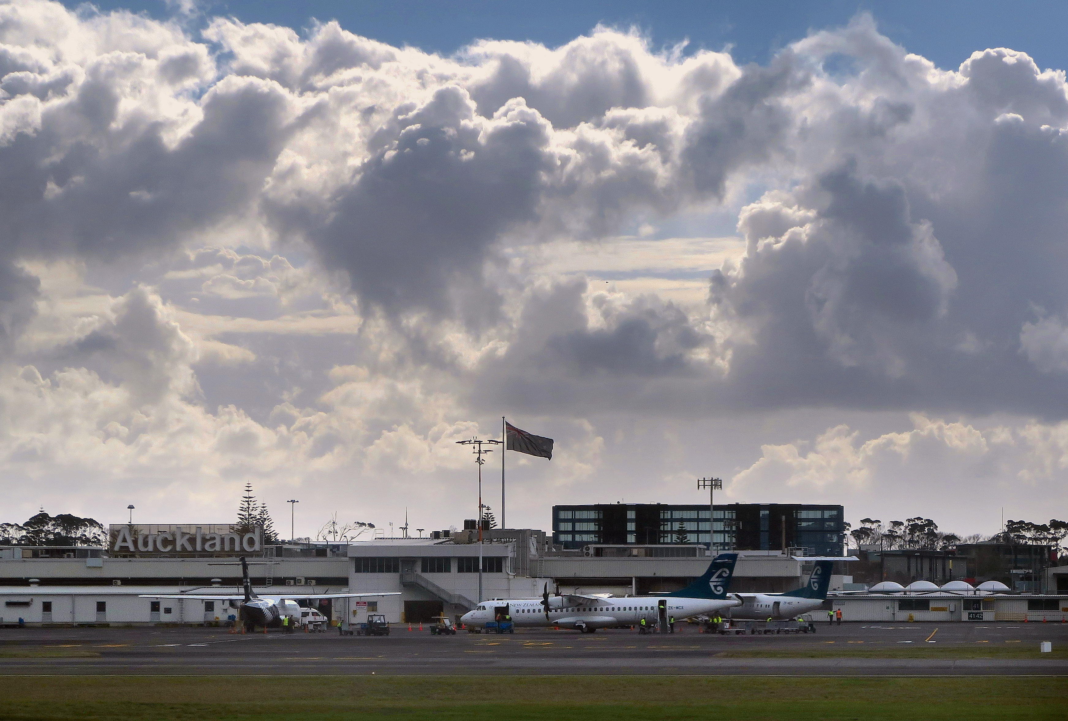 Air New Zealand Bombardier Q300 planes sit near the terminal at Auckland Airport in New Zealand