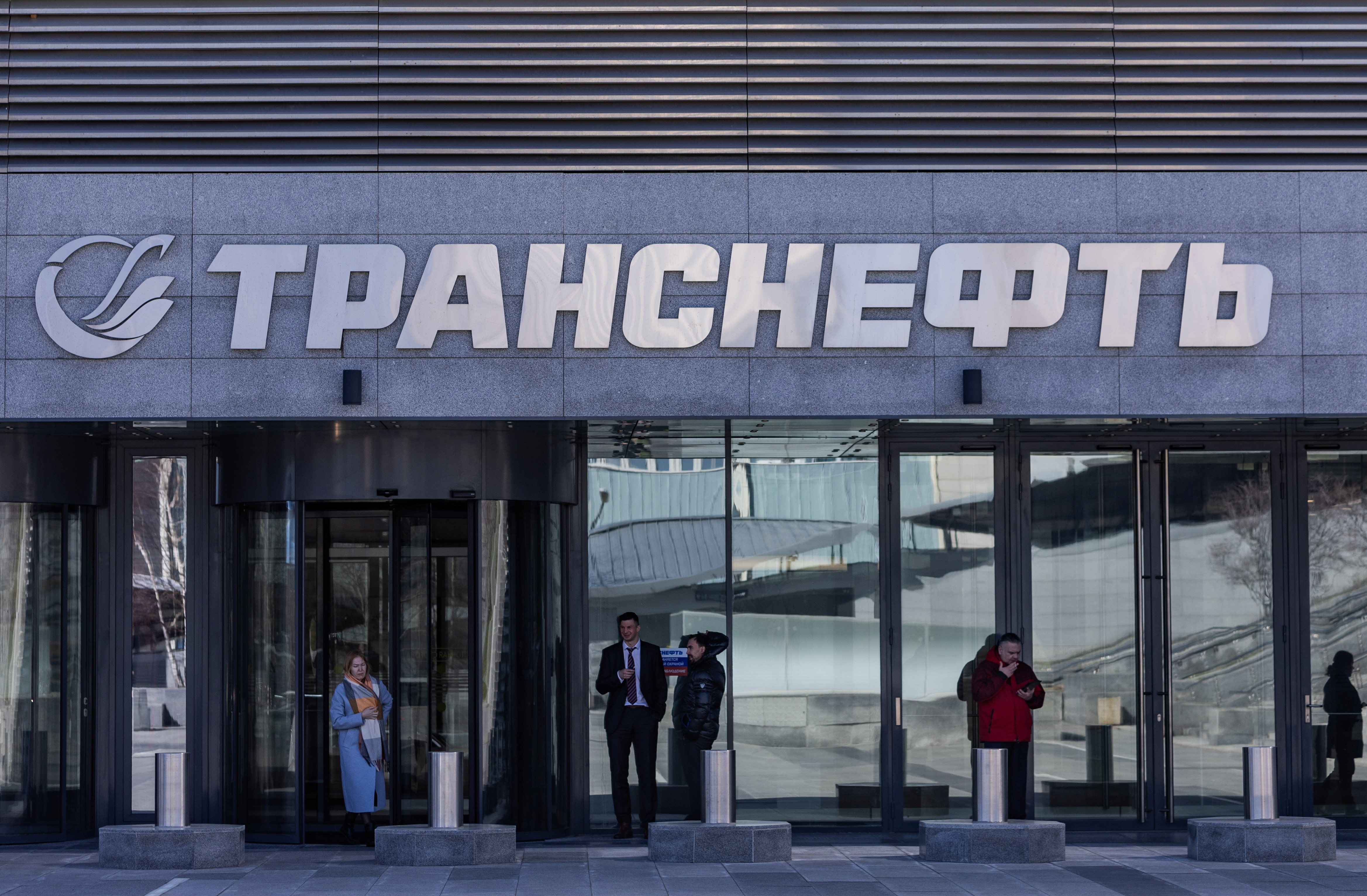 People stand next to an office of Transneft in Moscow