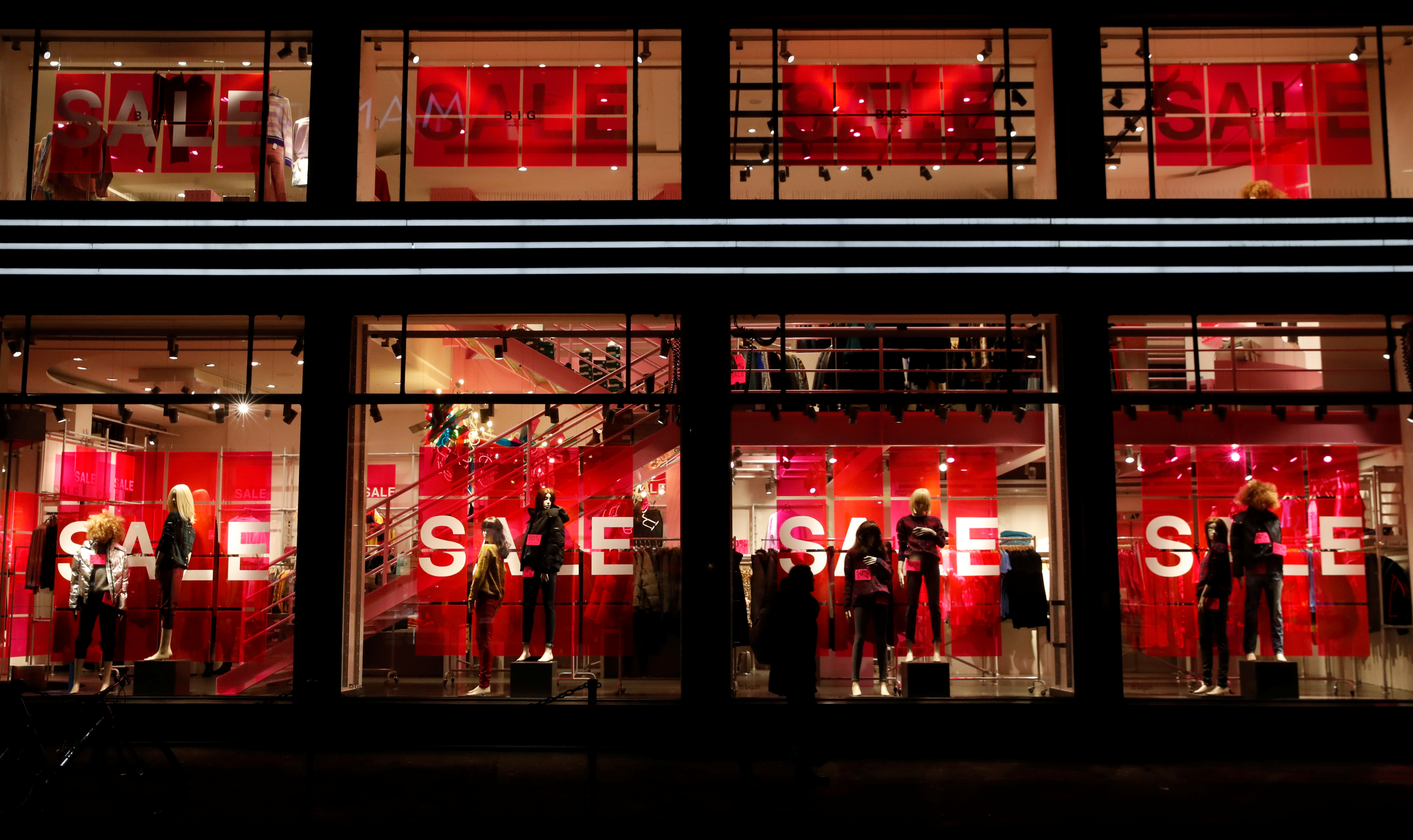 Sale discounts are offered on display windows of a H&M store in Zurich