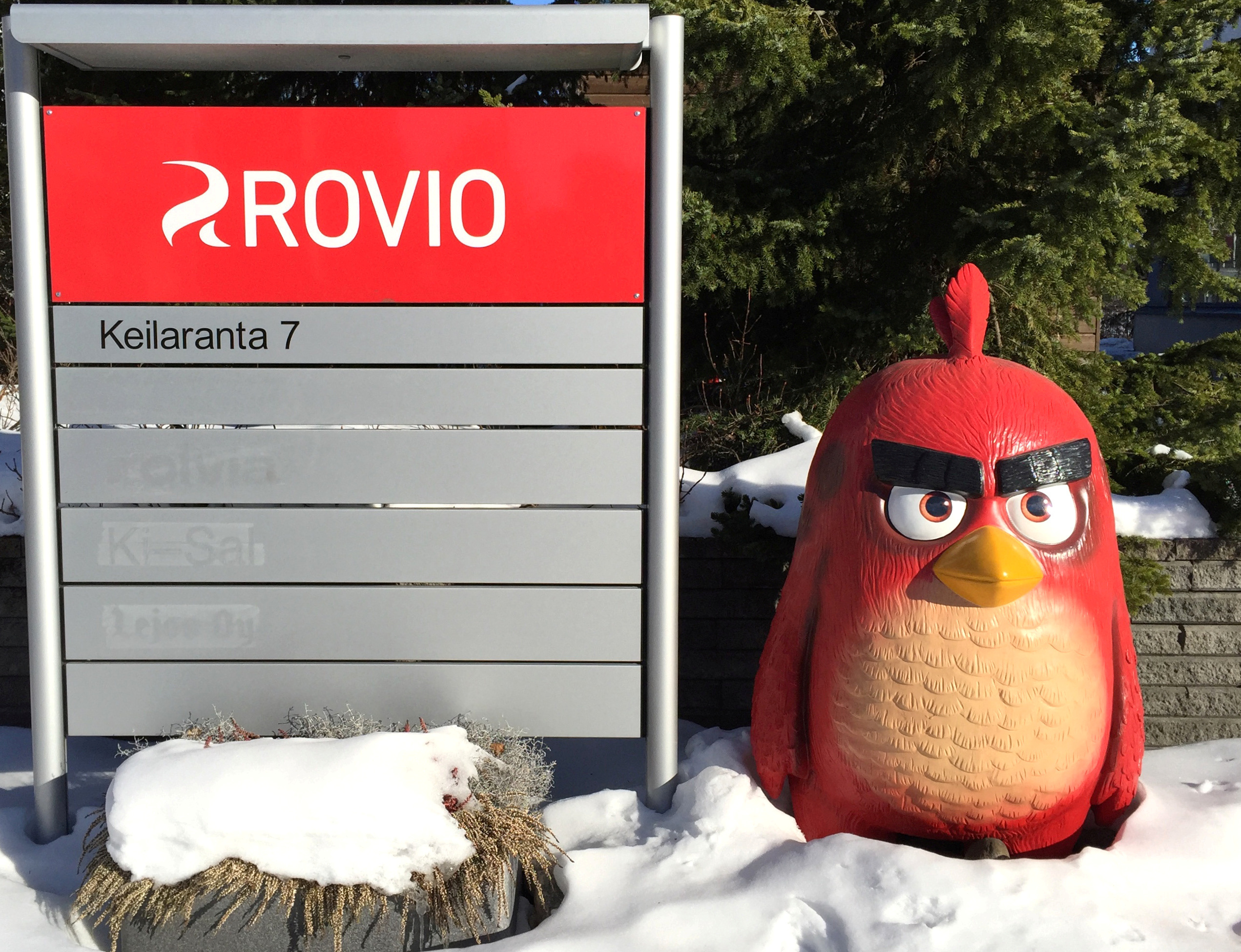 A Rovio sign and a figure of an Angry Birds character are seen in front of Rovio's headquarters in Espoo