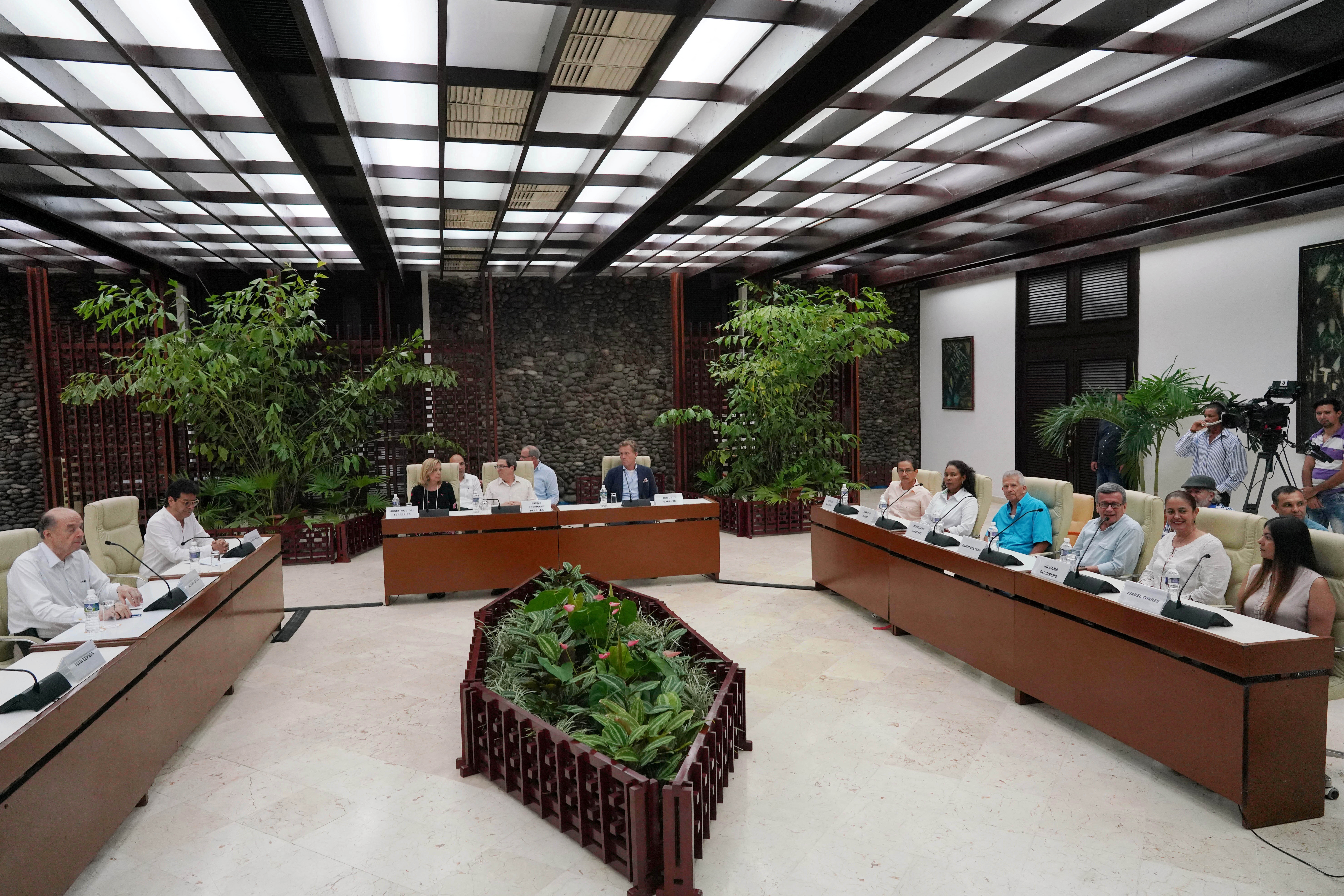 Members of Colombia's government and Colombia's National Liberation Army (ELN) delegation, together with Cuba's Foreign Ministry, take part in a news conference in Havana