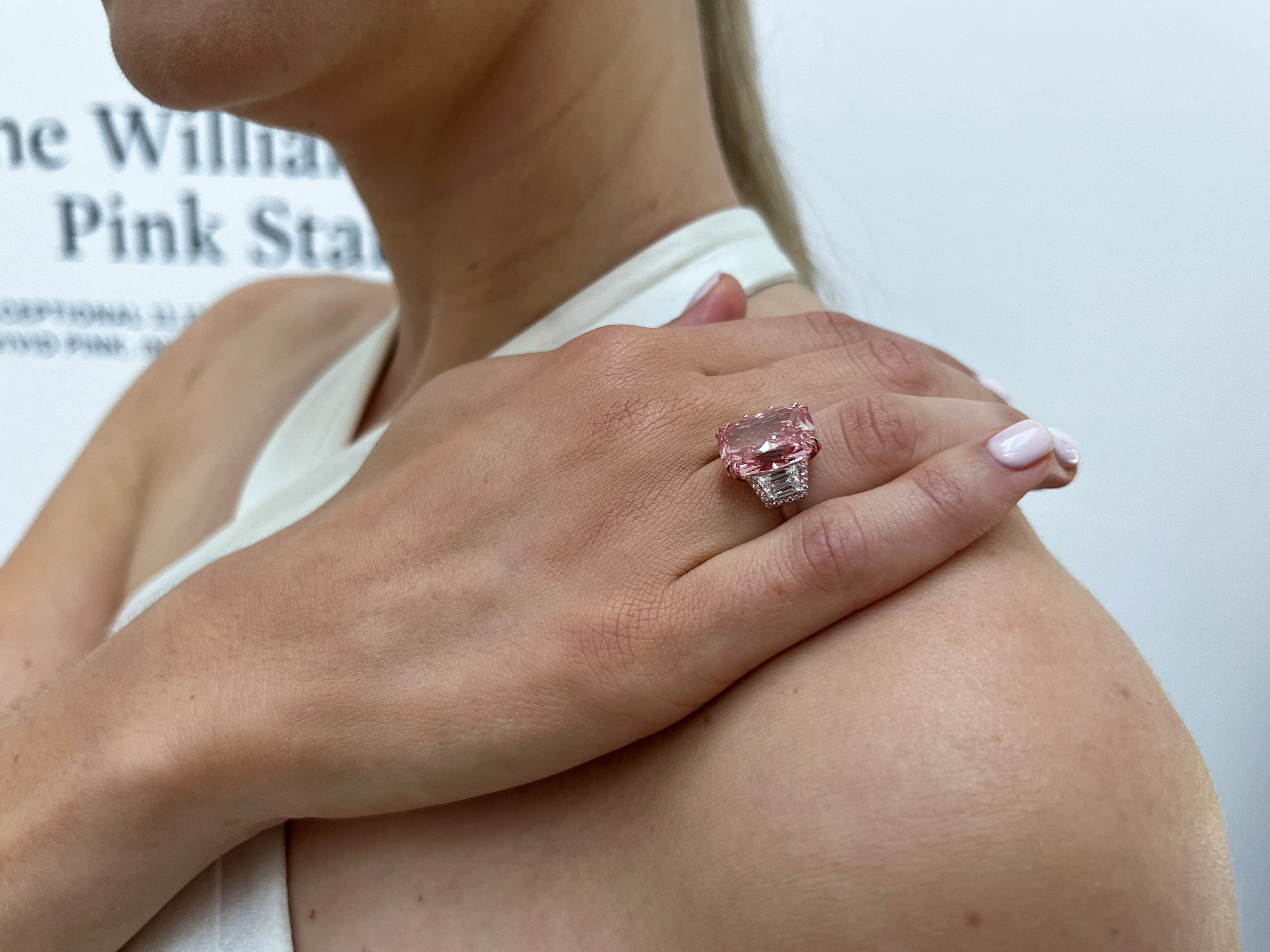 Model poses with a pink diamond due to put up for auction at Sotheby’s auction house in London