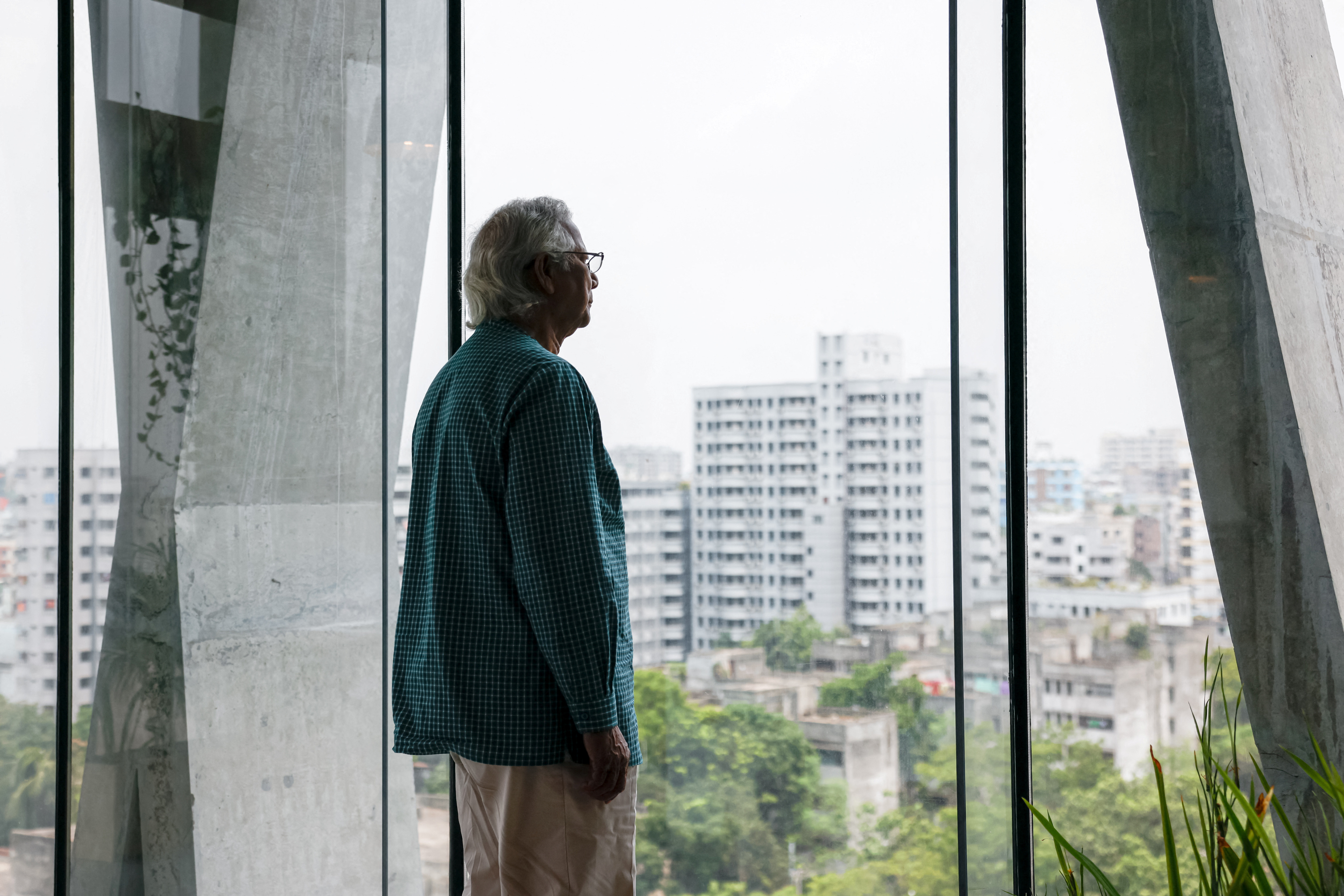 Bangladeshi Nobel Peace Prize winner Dr. Muhammad Yunus looks on as he poses for photo during an interview with Reuters in his office, in Dhaka