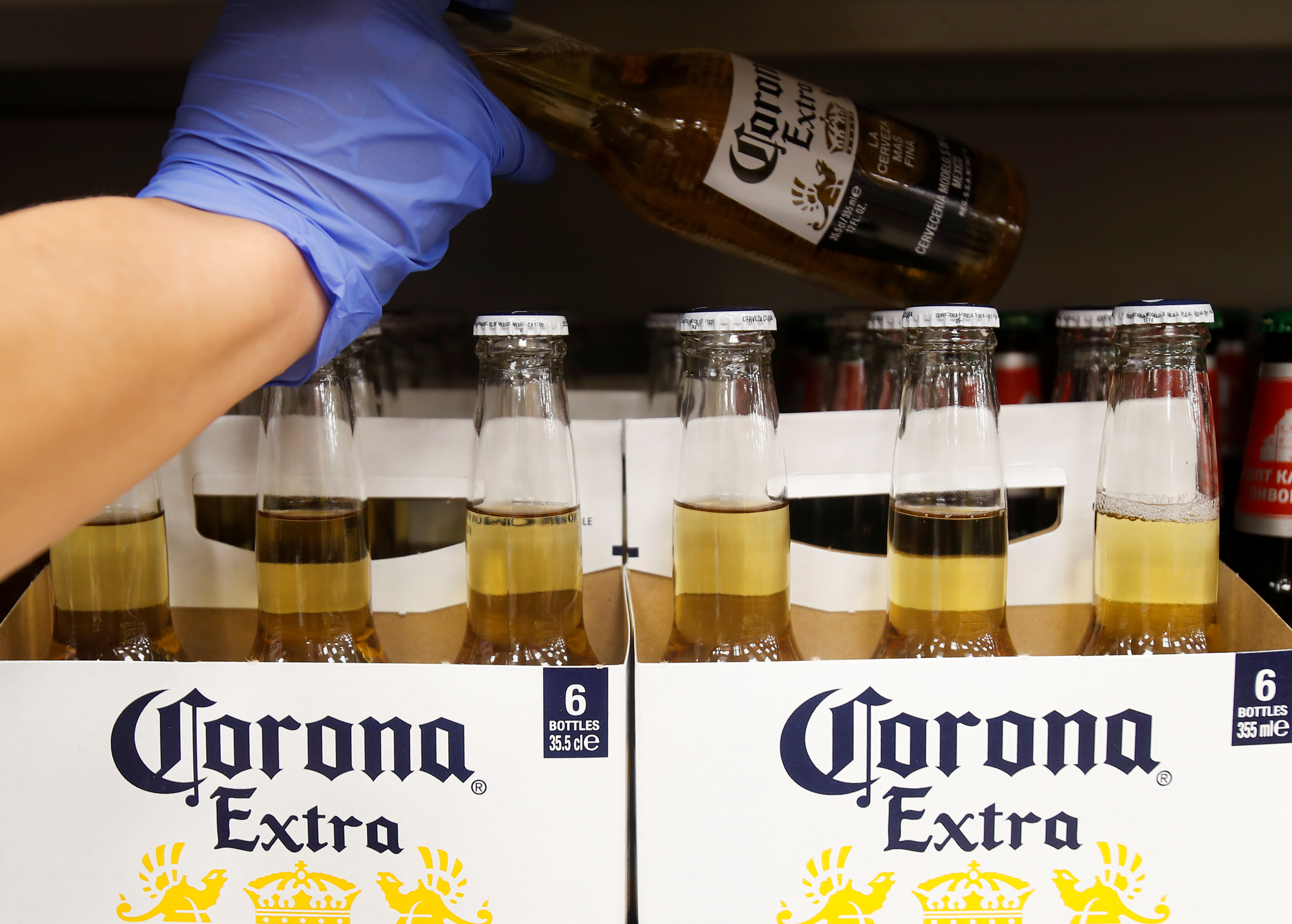 Bottles of Corona Extra beer are displayed for sale in a supermarket amid the coronavirus disease (COVID-19) pandemic in Moscow, Russia April 8, 2020. REUTERS/Maxim Shemetov