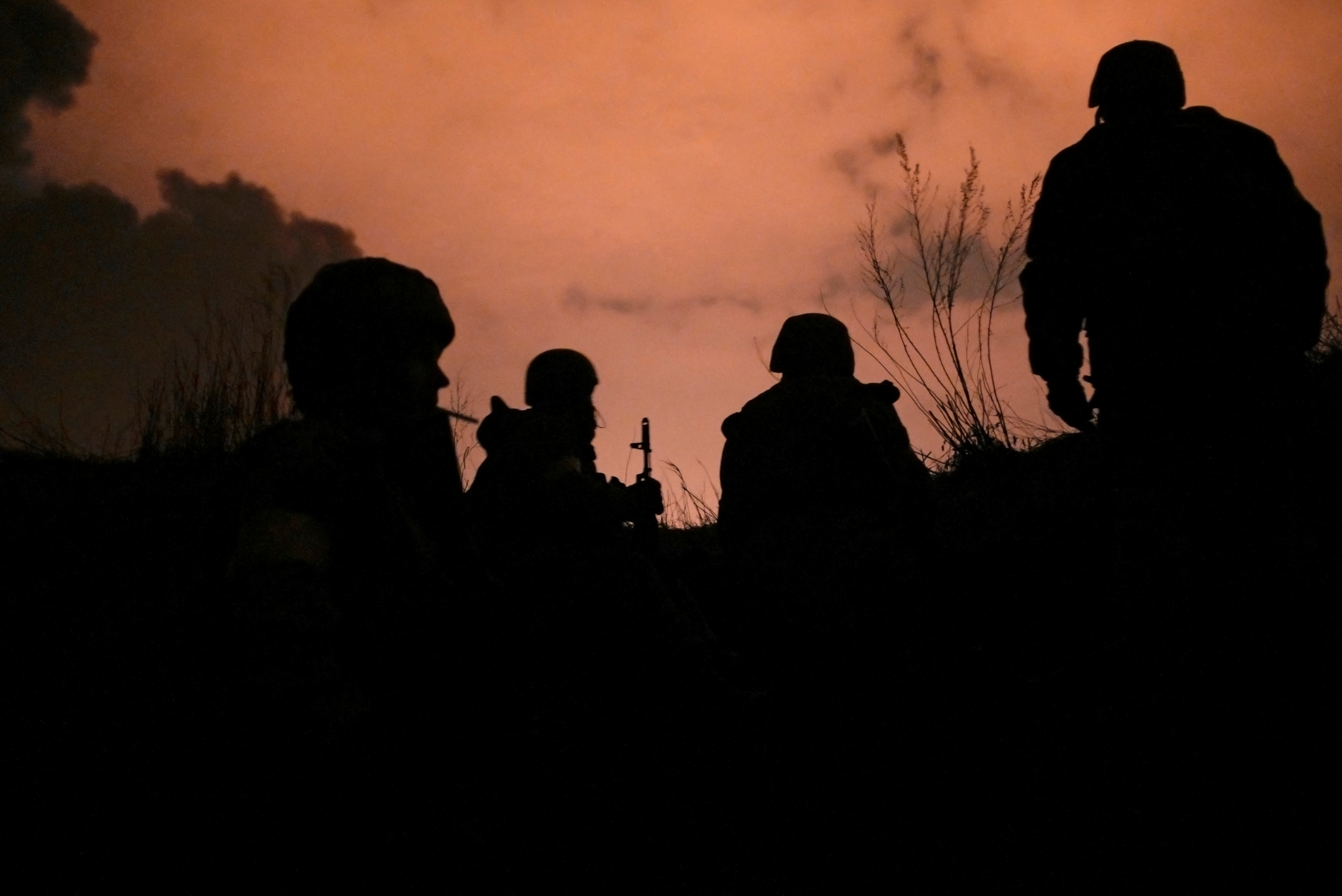 Ukrainian servicemen take positions at the military airbase Vasylkiv in the Kyiv region