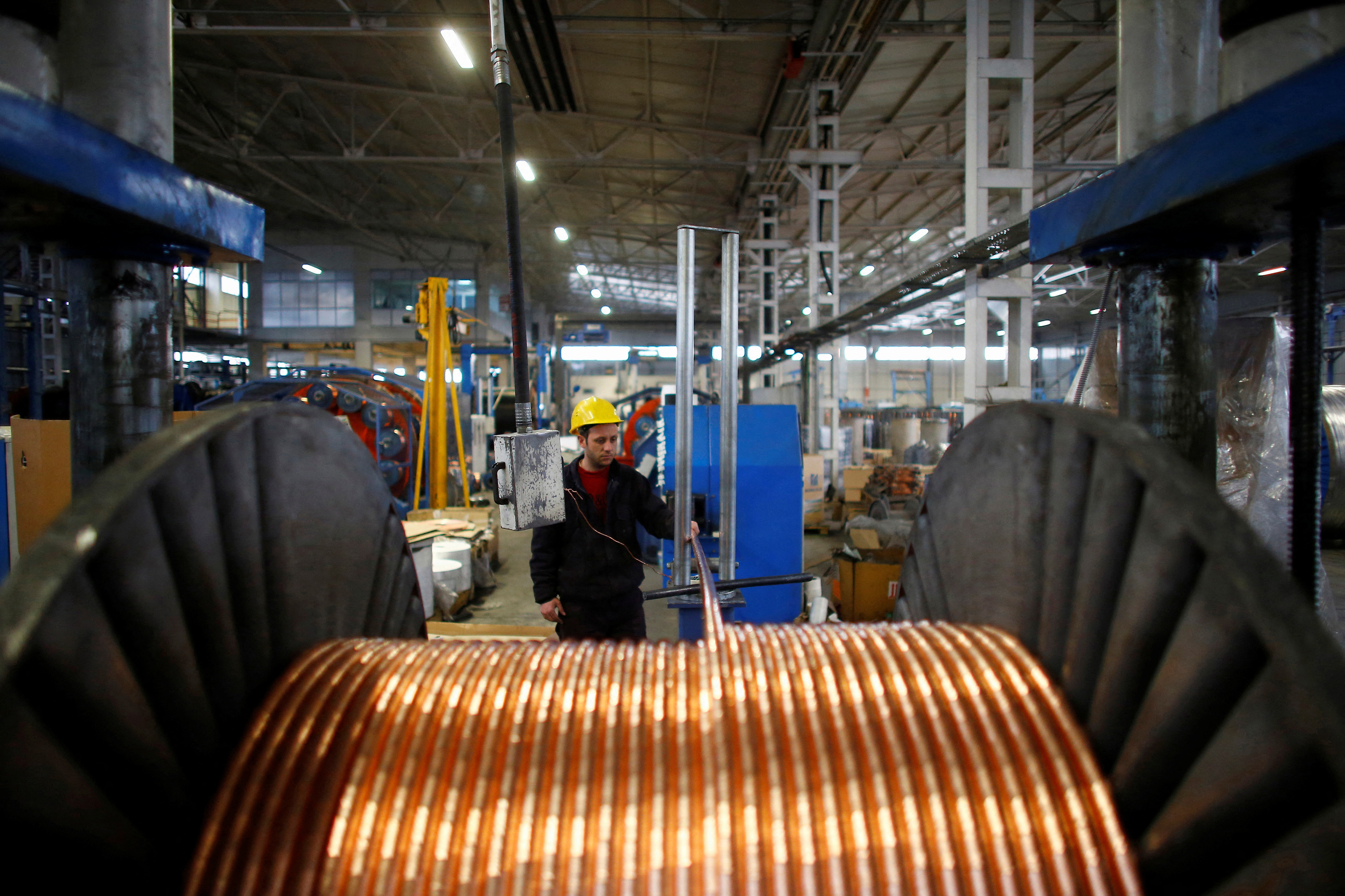 A worker checks copper cables being produced at a factory in the central Anatolian city of Kayseri