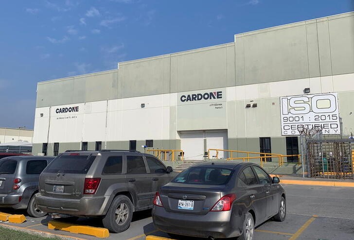 Cars are parked outside the Tridonex auto-parts plant, owned by Philadelphia-based Cardone Industries, in Matamoros