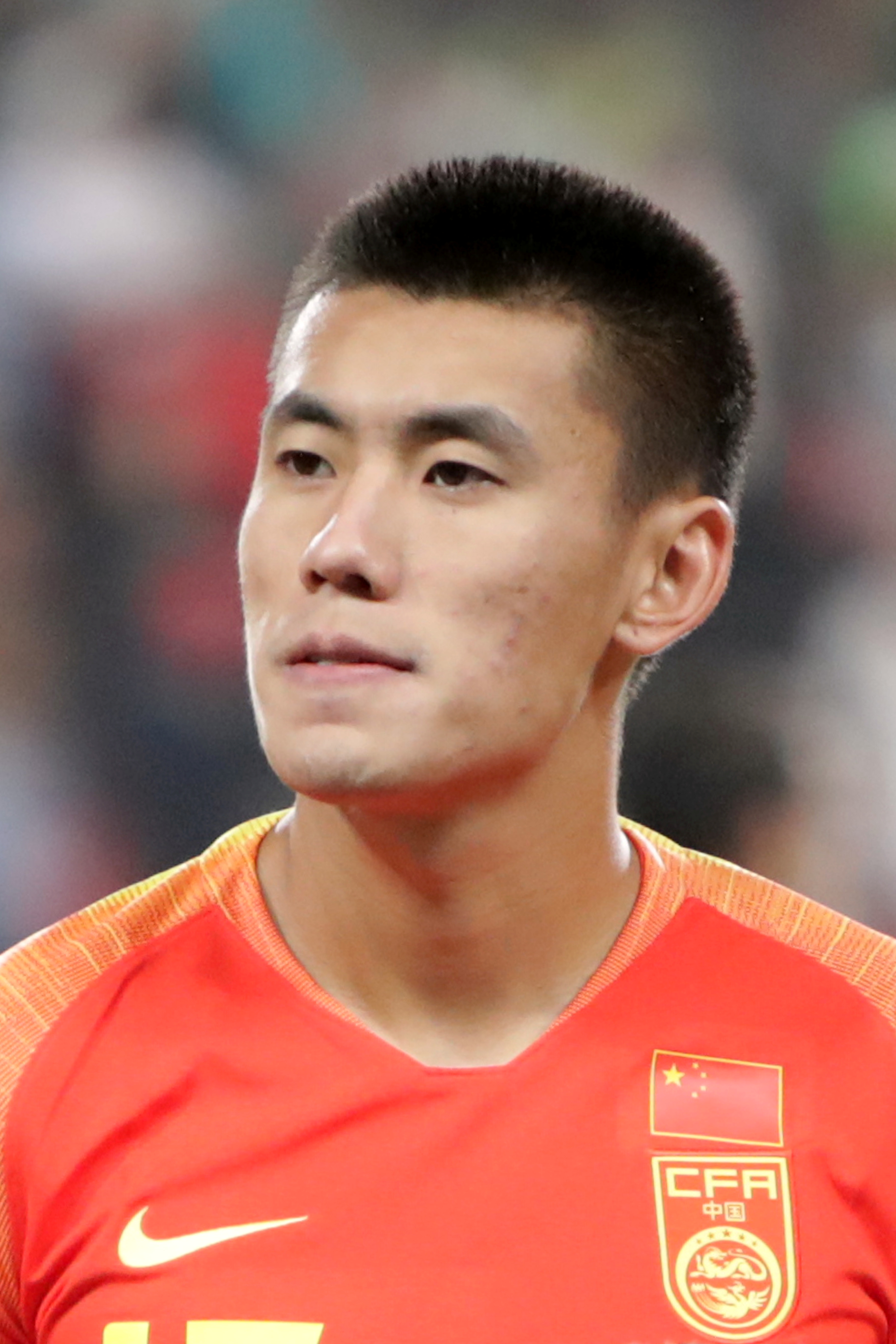 China's Zhang Rui is ejected after receiving a red card against