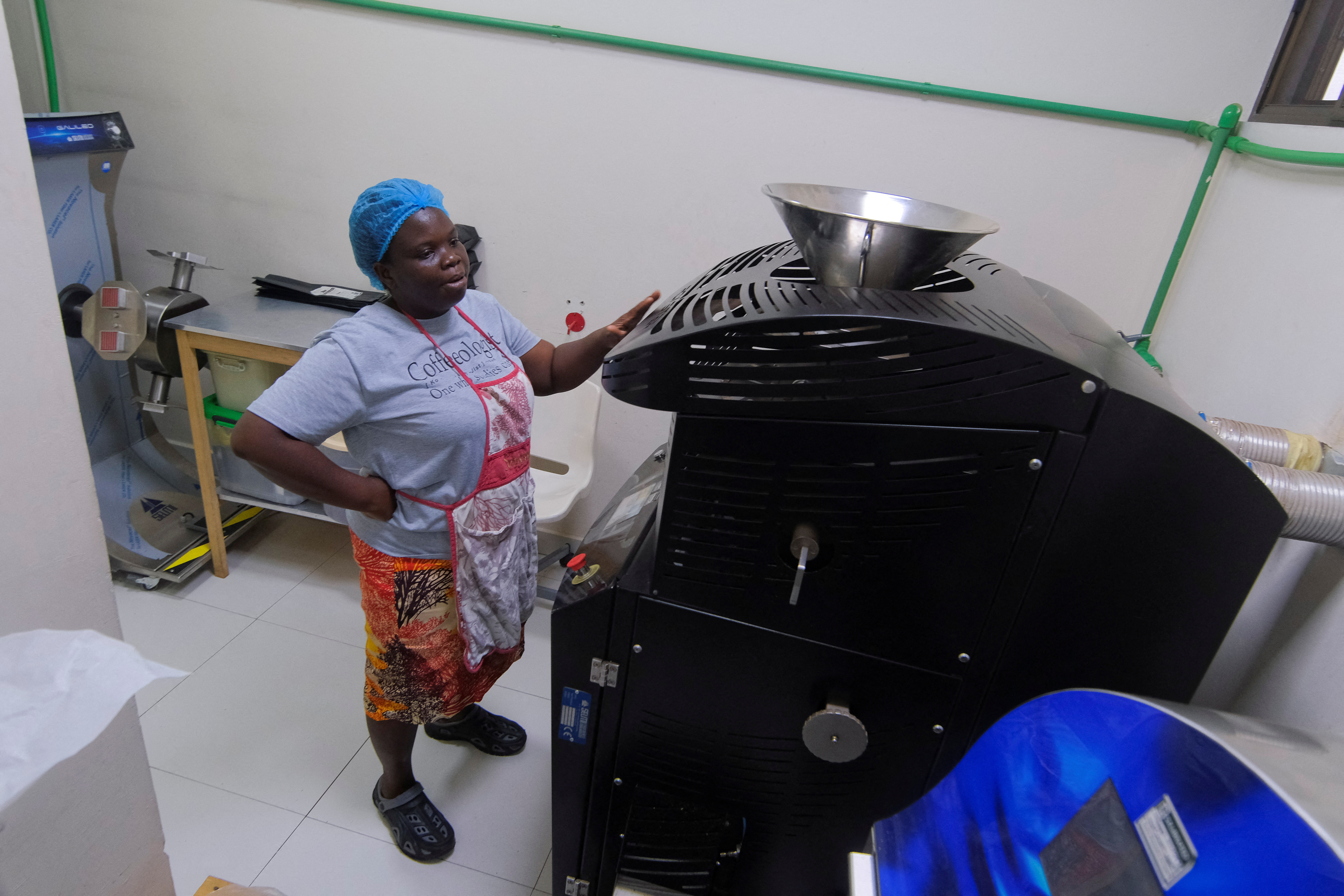 Benedicta Tamakloe, a coffee entrepreneur, operates a coffee roaster inside a chocolate factory in Accra