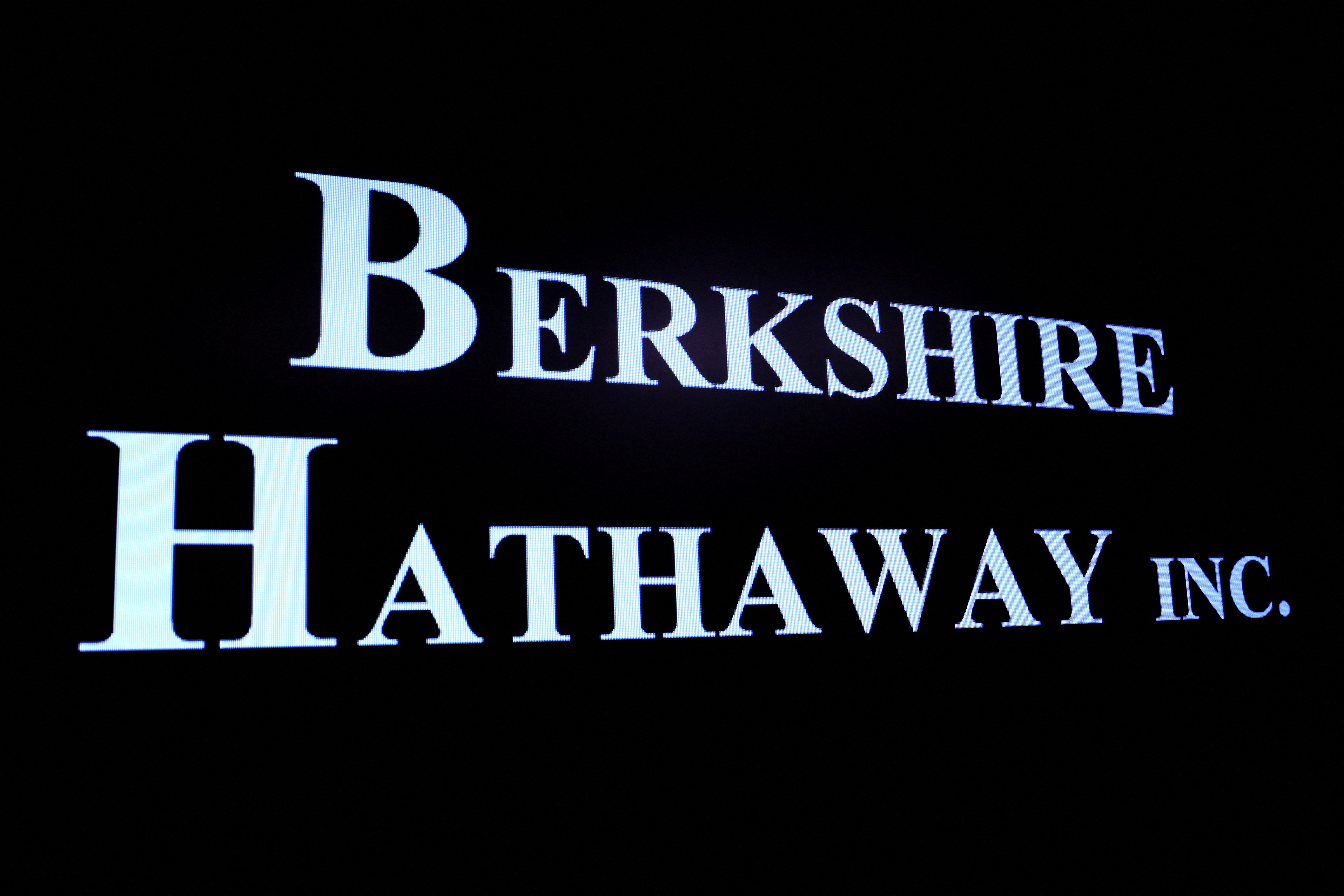Berkshire Hathaway logo is displayed on a screen on the floor of the NYSE in New York