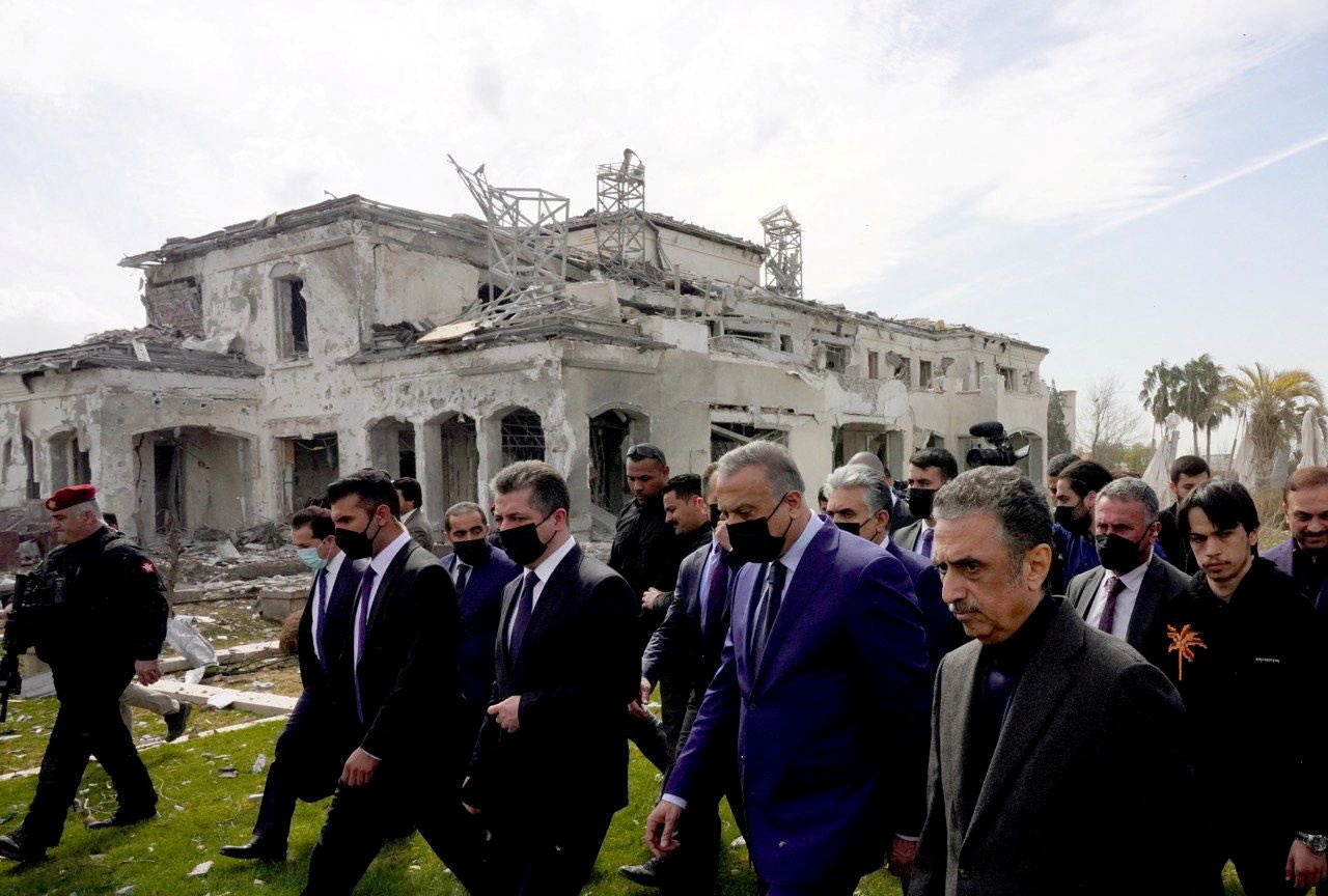 Iraqi Prime Minister Mustafa Al-Kadhimi inspects the site of a damaged building a day after a missile attack, in Erbil