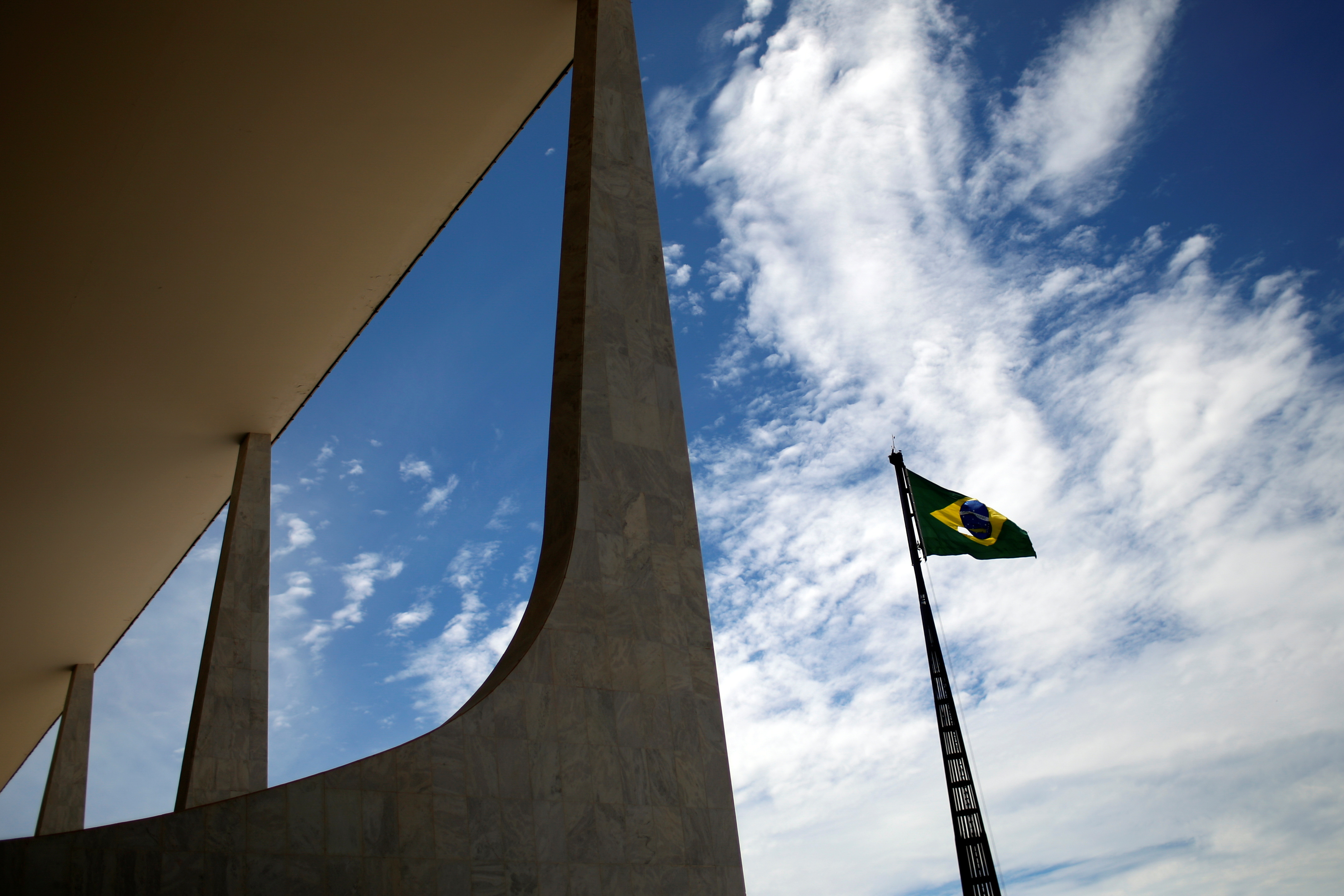 General view of a torn Brazilian flag, next to the Planalto Palace in Brasilia