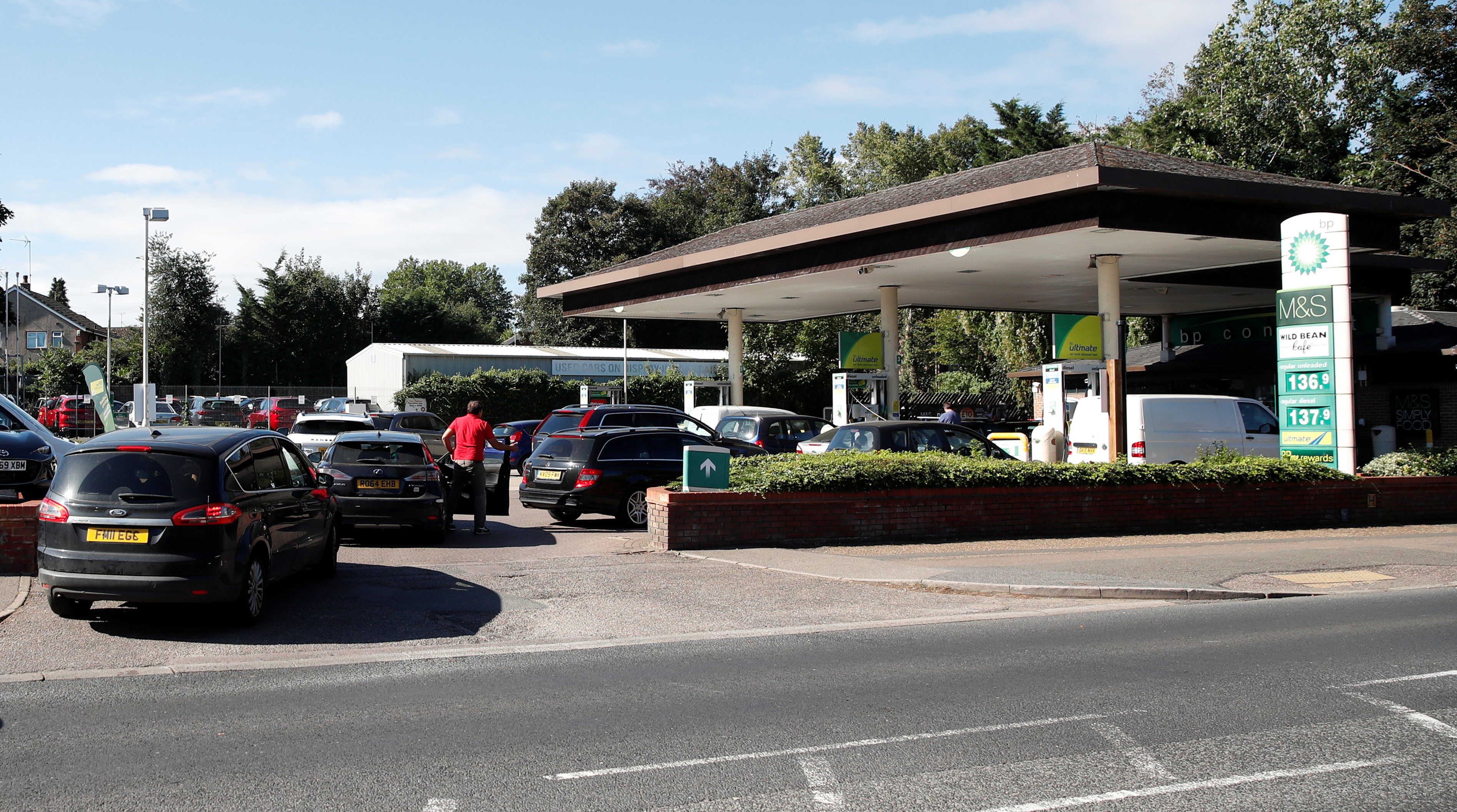 Vehicles queue up to enter the BP petrol station, in Harpenden