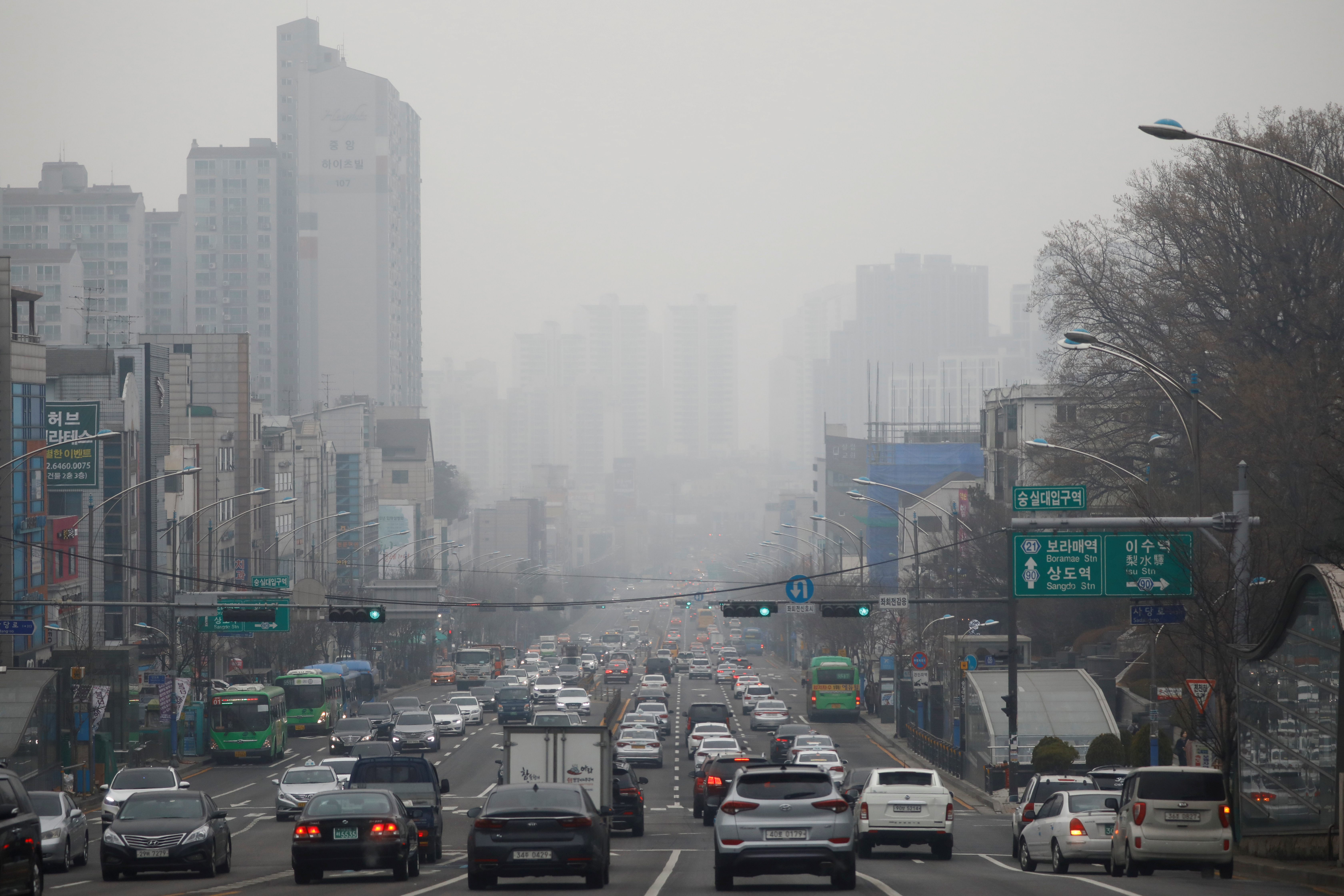 Vehicles move on a road on a polluted day in Seoul