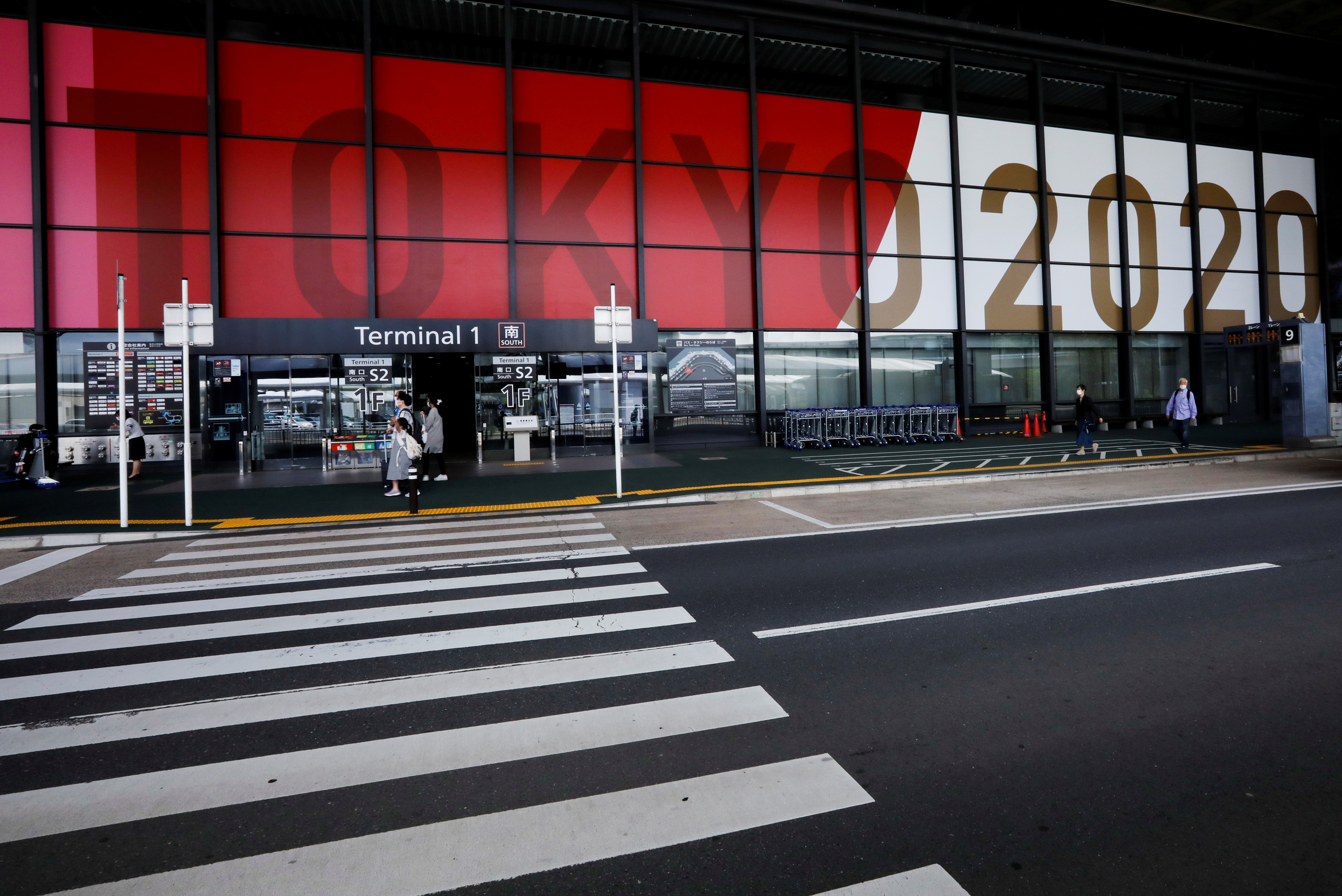 Tokyo 2020 Olympic and Paralympic Games advertisements are displayed at Narita international airport