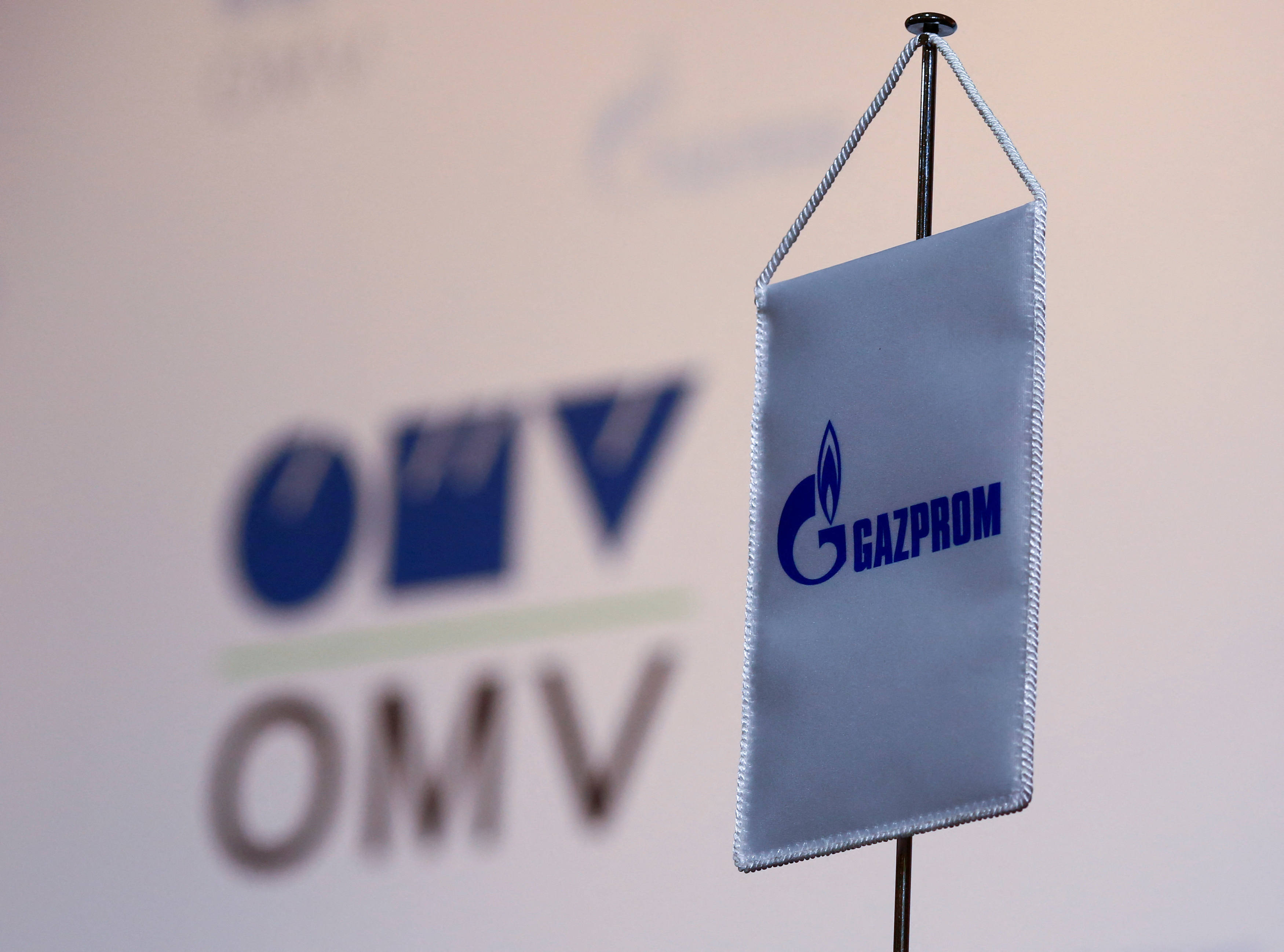 The logos of Austrian oil and gas group OMV and Gazprom are seen in Vienna