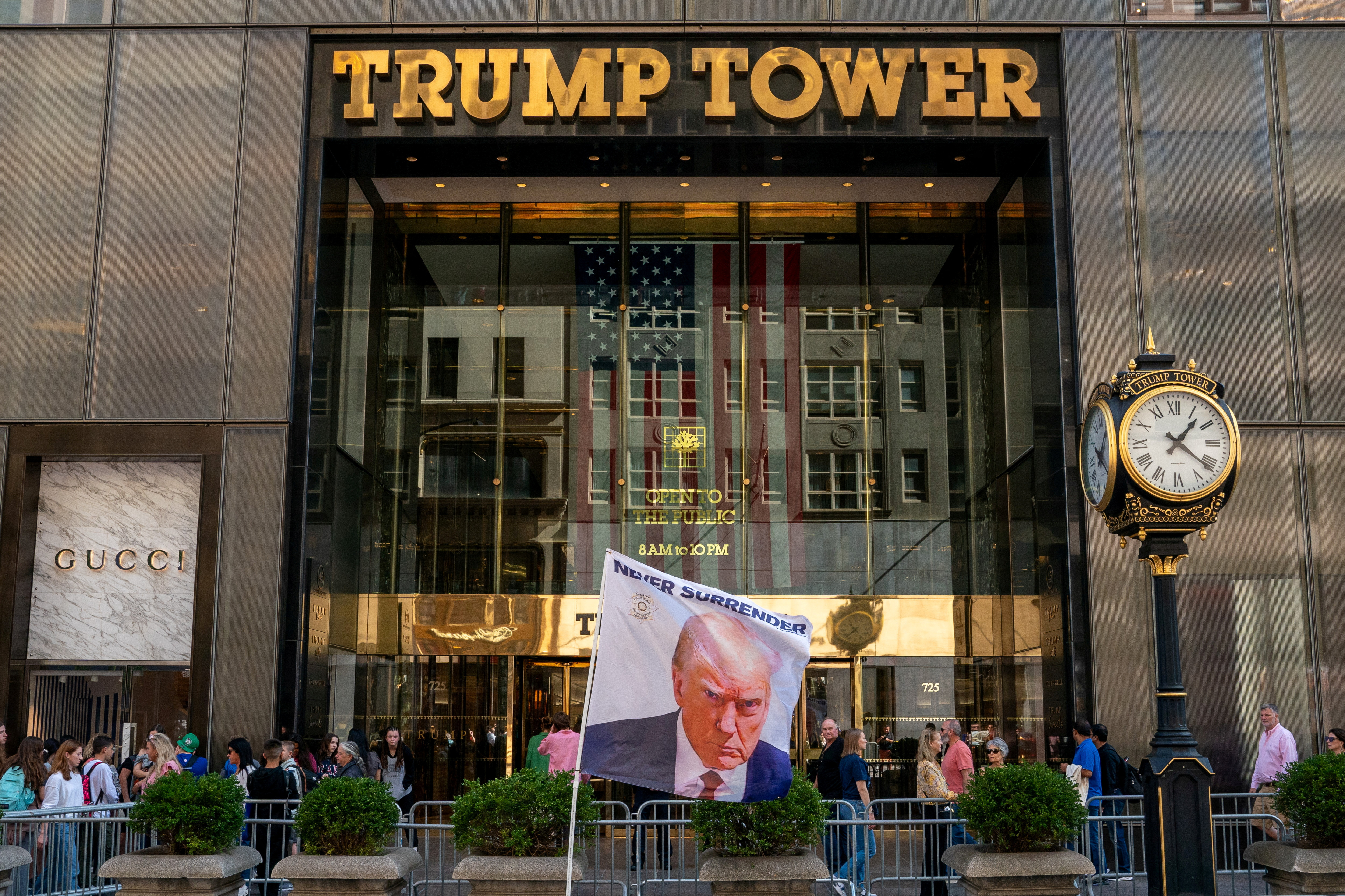 A flag depicting former U.S. President Trump is placed at Trump Tower in New York City
