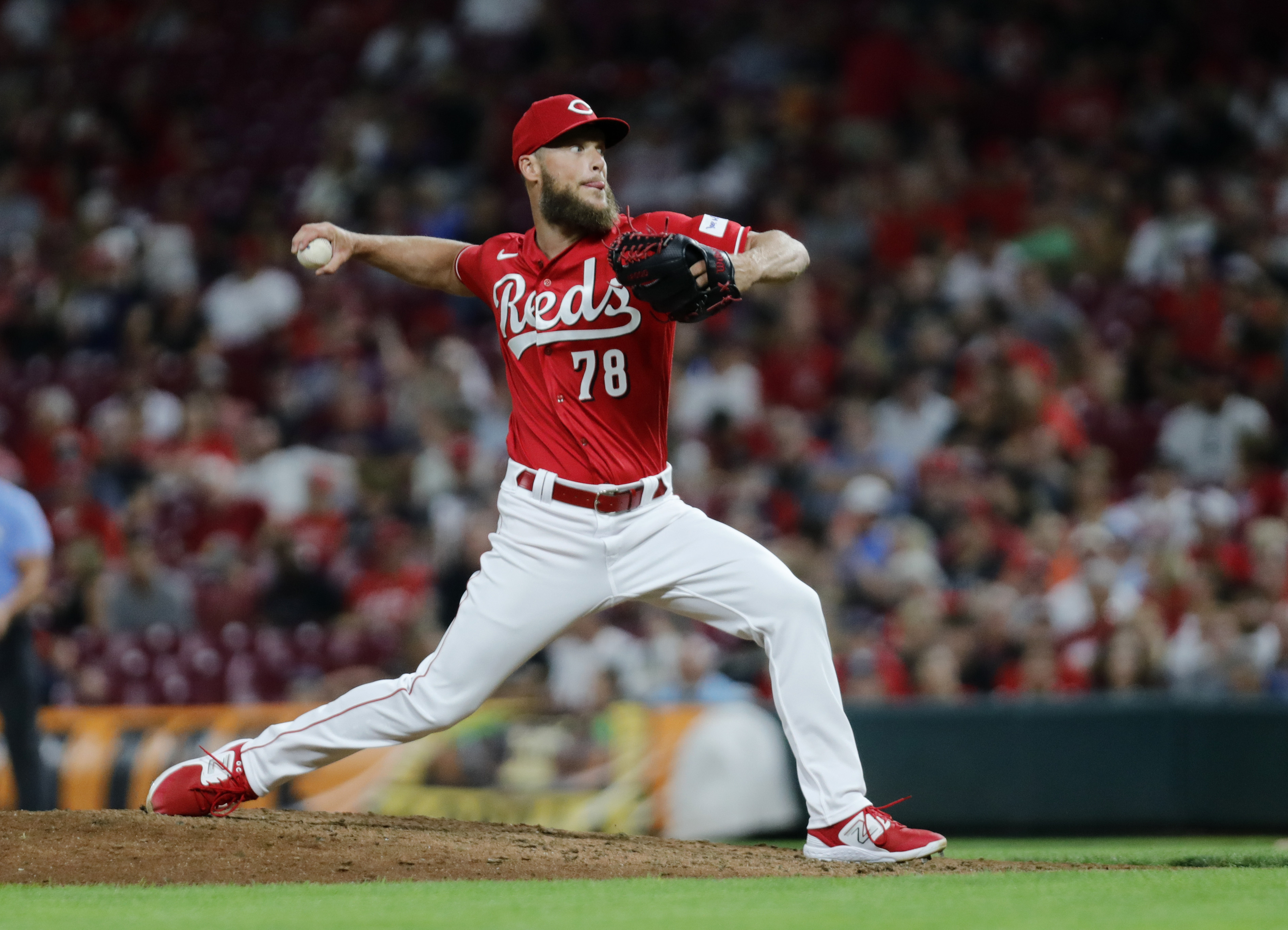 Reds earn split with Guardians behind all-around effort