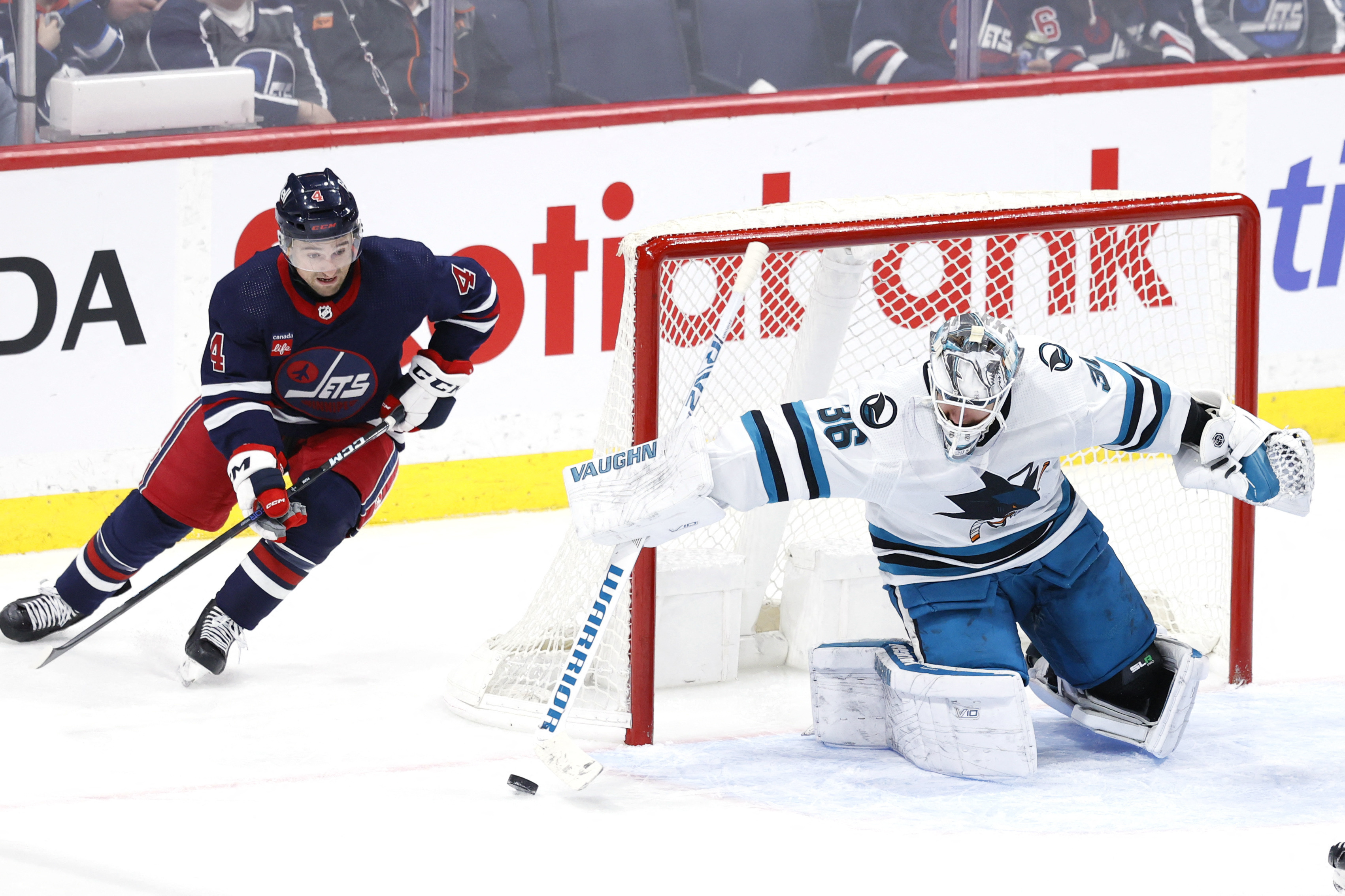 Connor Hellebuyck, Jets Blank Sharks 1-0 | Reuters