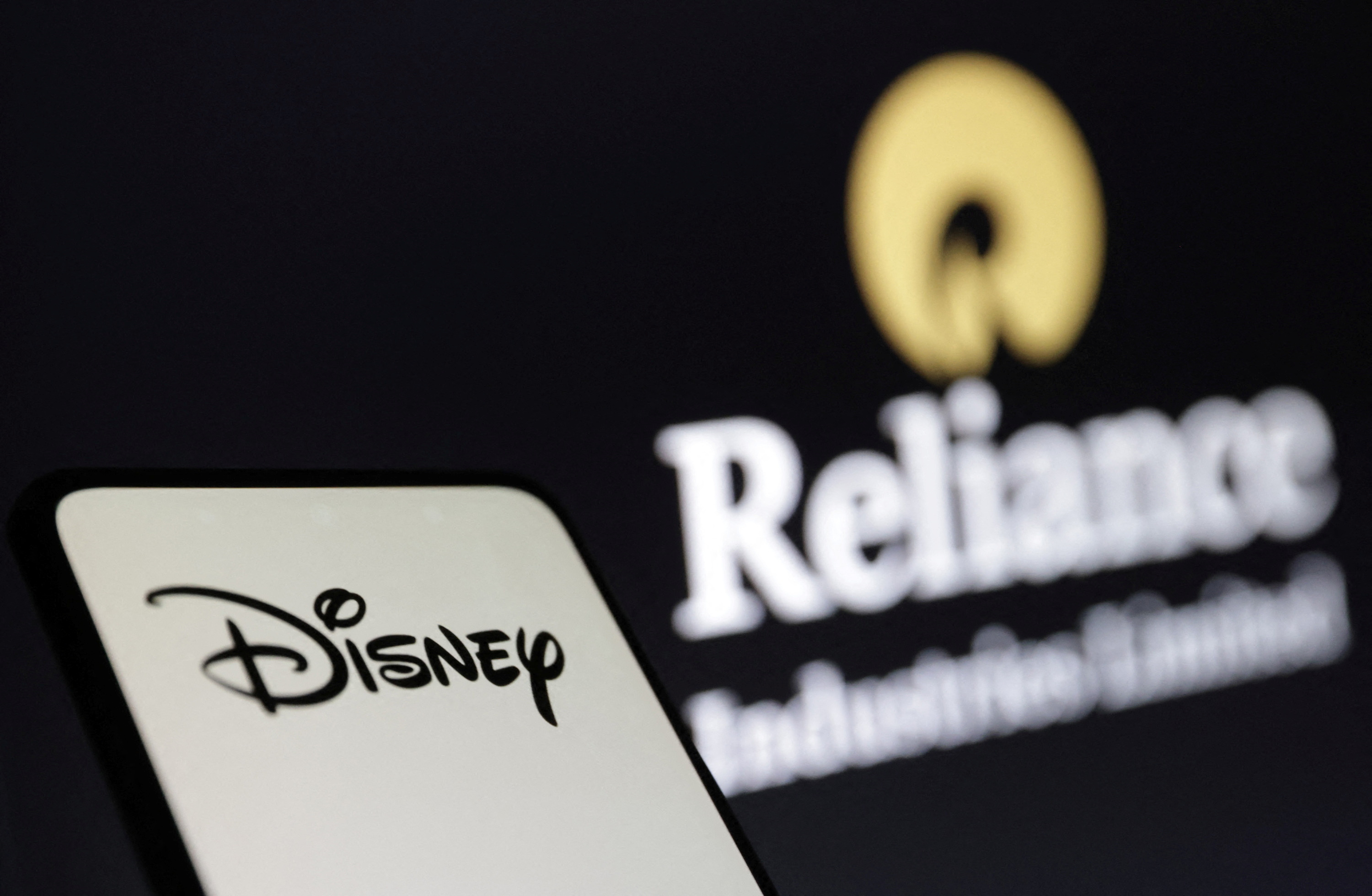 Illustration shows Disney and Reliance logos