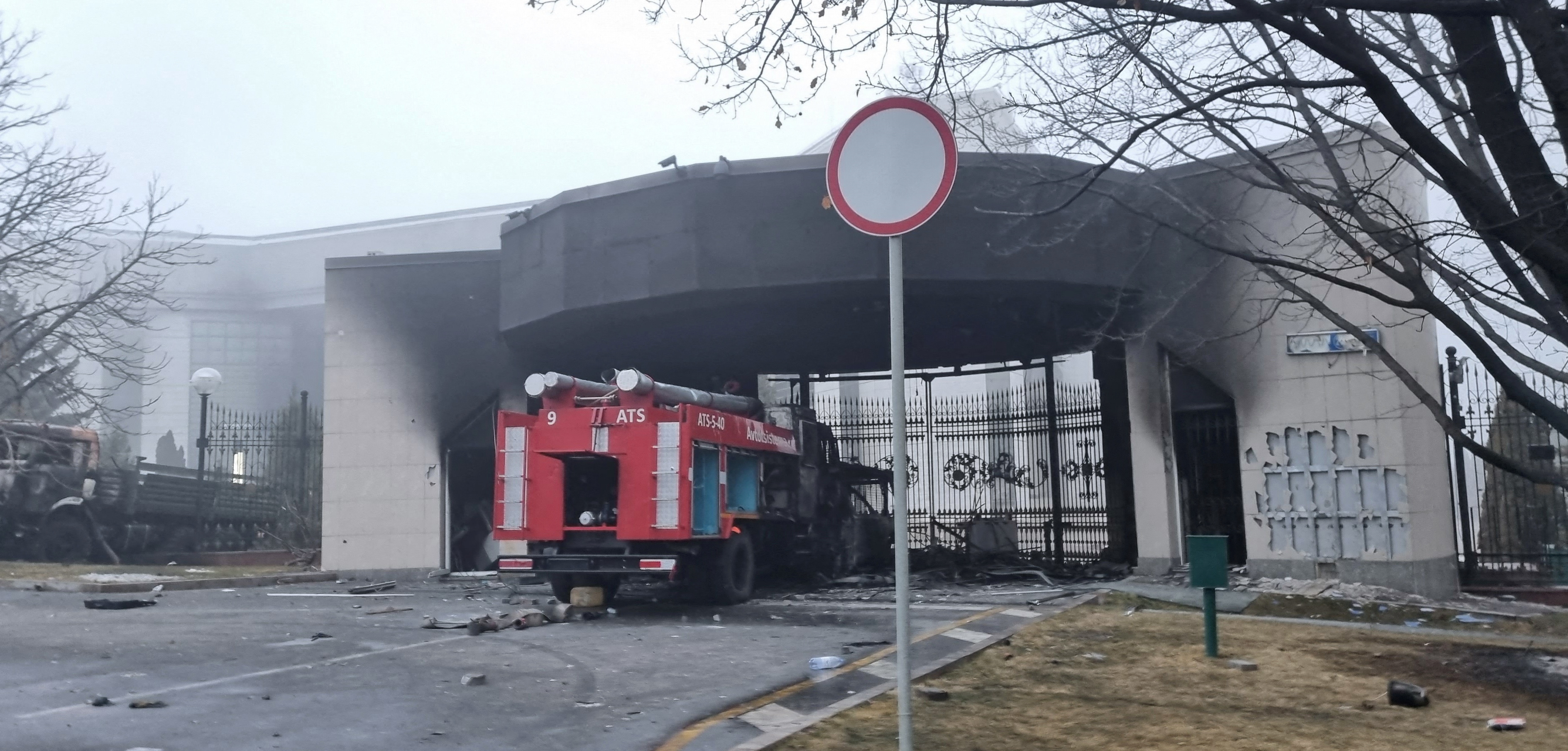 A burned fire truck is seen in front of the Presidential Residence in Almaty