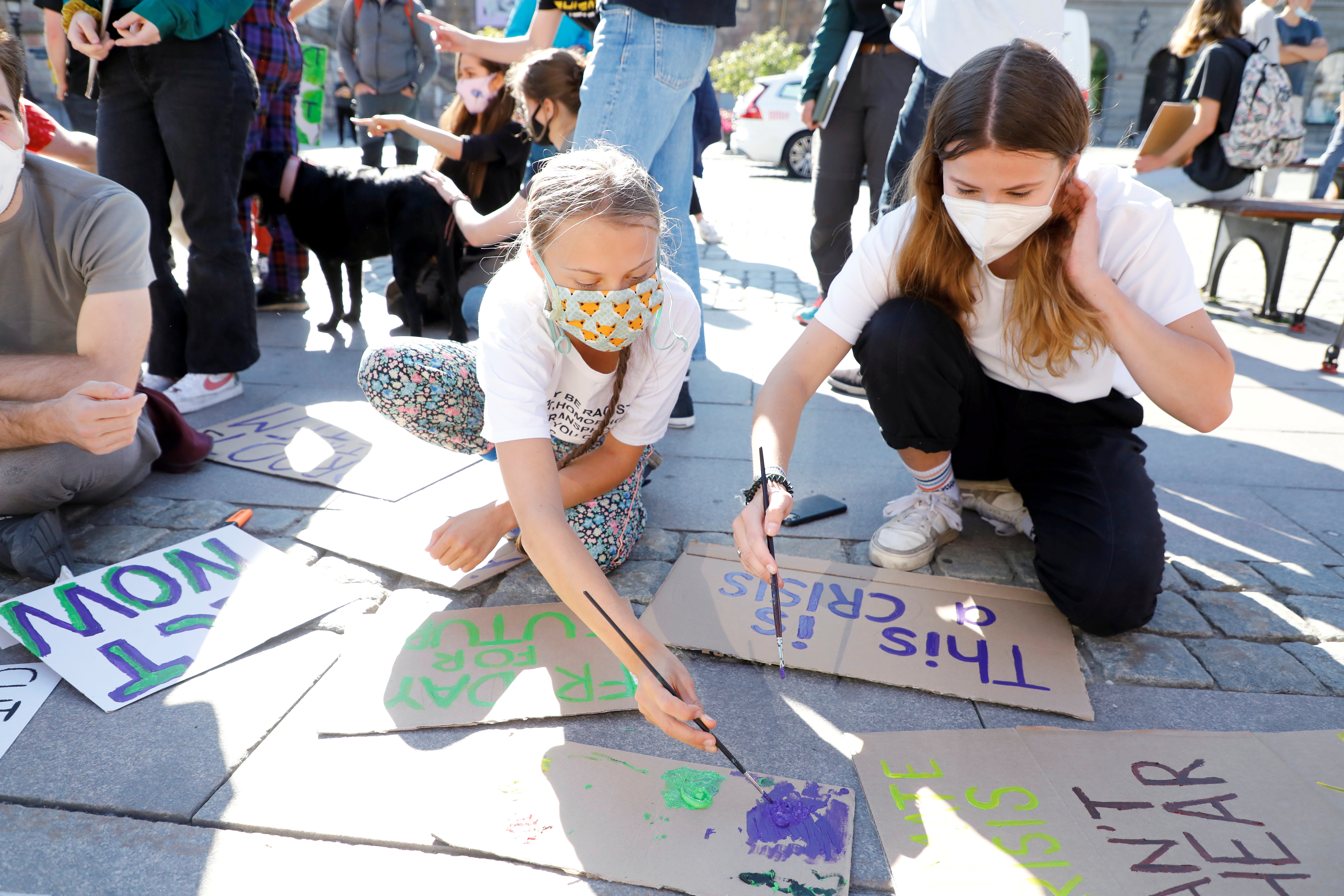 Greta Thunberg and Luisa Neubauer protest outside the Swedish Parliament
