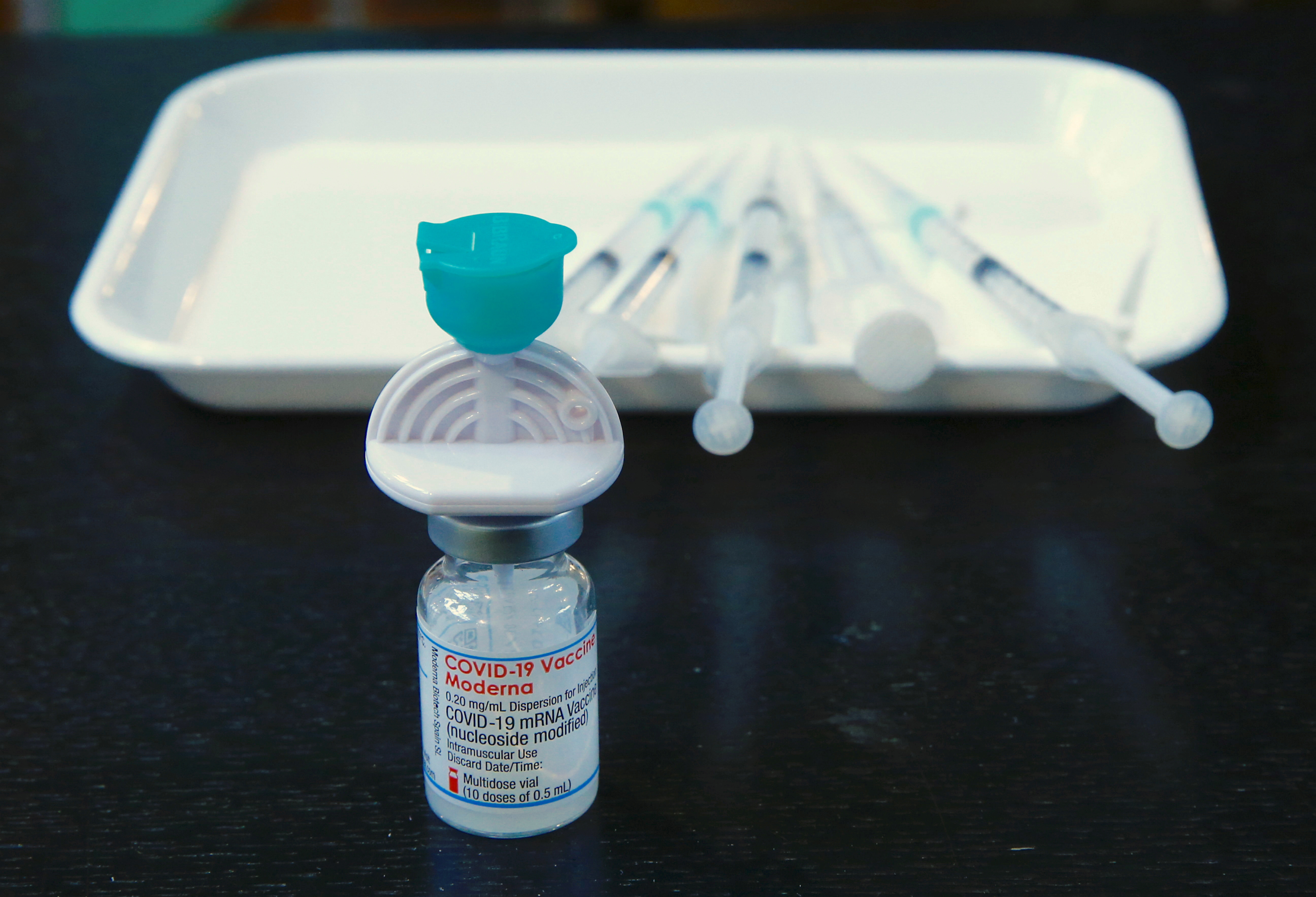 A  vial containing the Moderna COVID-19 vaccine is seen at a temporarily vaccination center