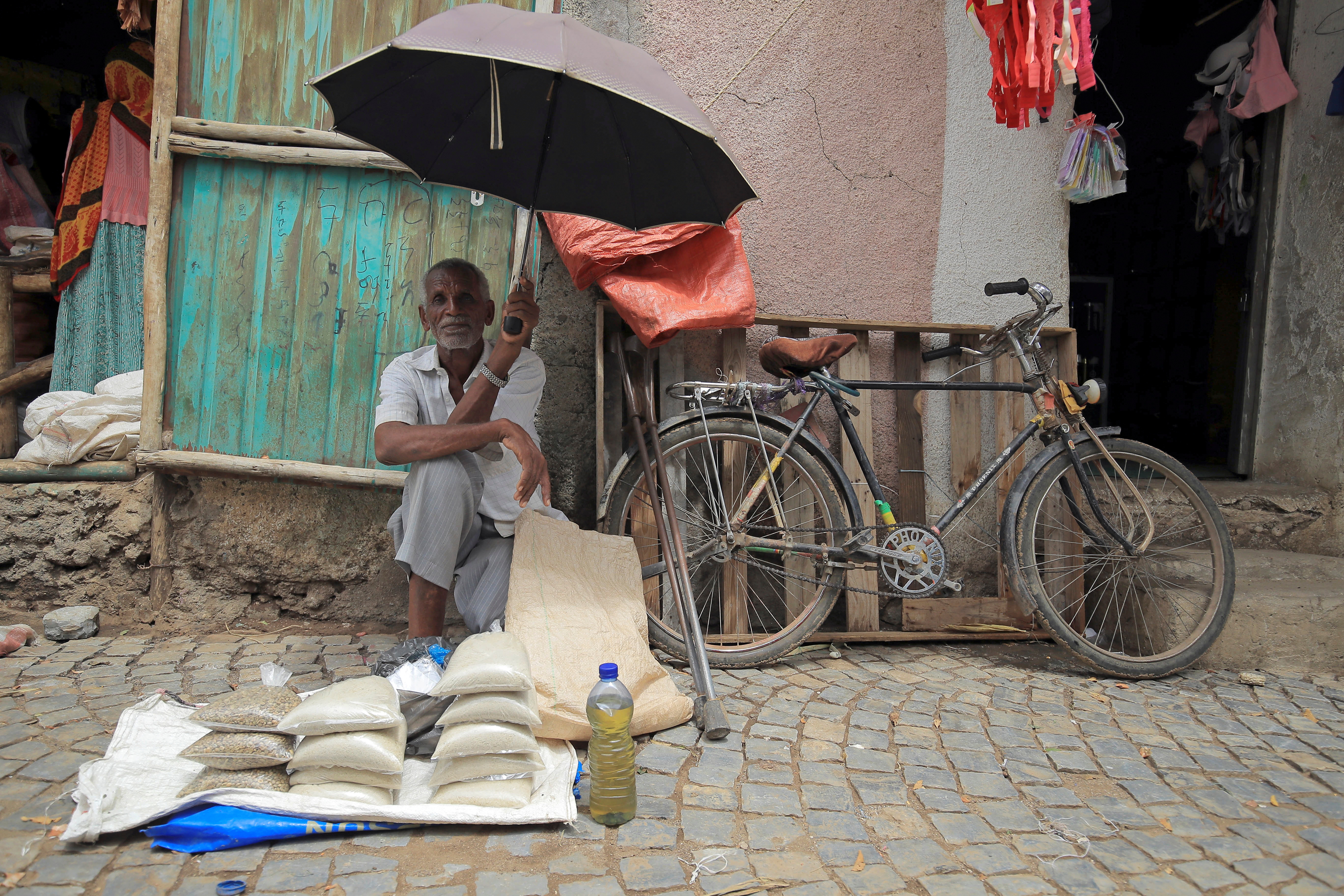 A vendor waits for his customers in a local market of Humera town