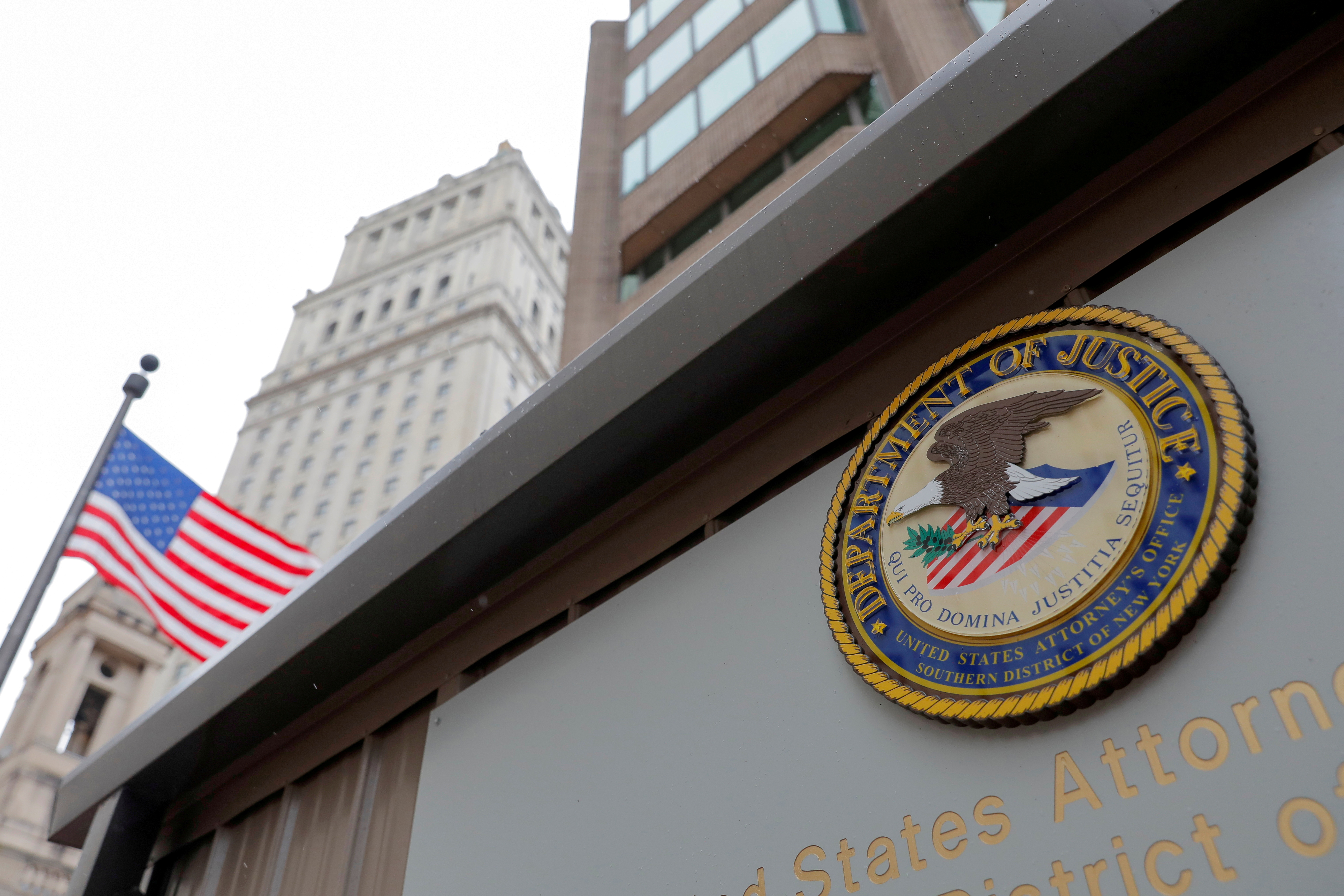 The seal of the United States Department of Justice is seen on the building exterior of the United States Attorney's Office of the Southern District of New York in Manhattan, New York City, U.S., August 17, 2020. REUTERS/Andrew Kelly