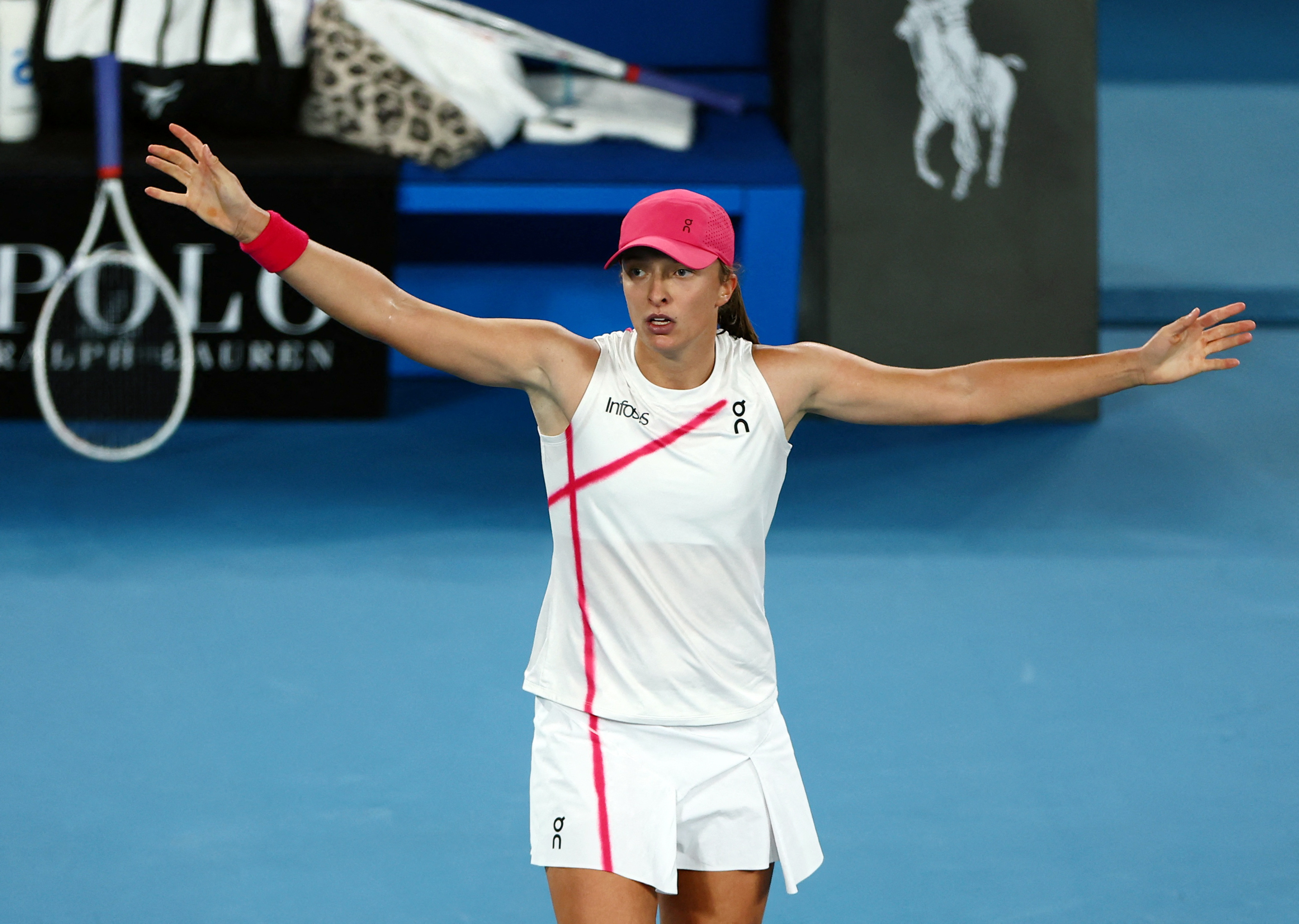 World number one Swiatek survives huge Collins scare | Reuters