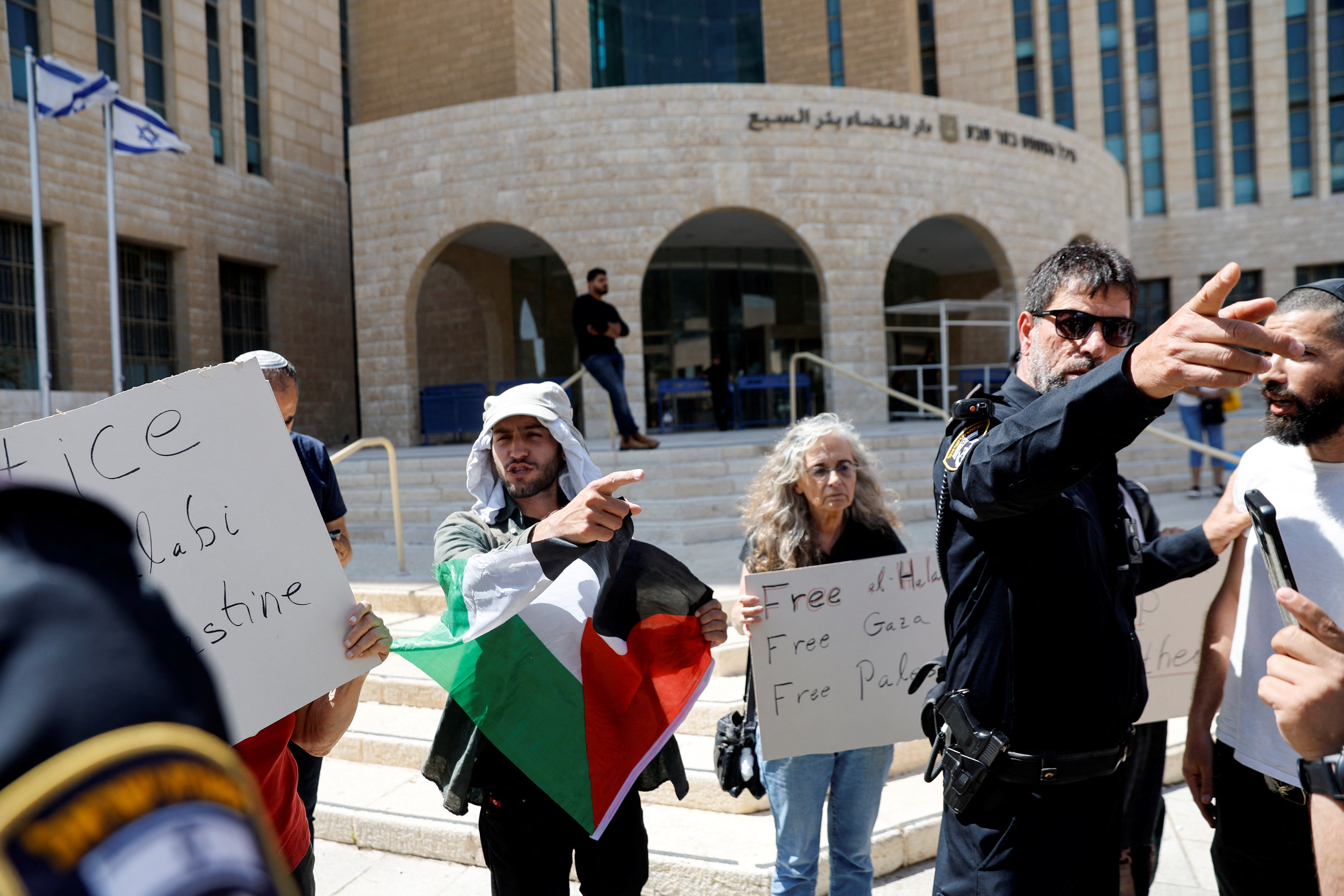 Protesters supporting Palestinian Mohammad El Halabi, demonstrate outside an Israeli court in Beersheba, Israel