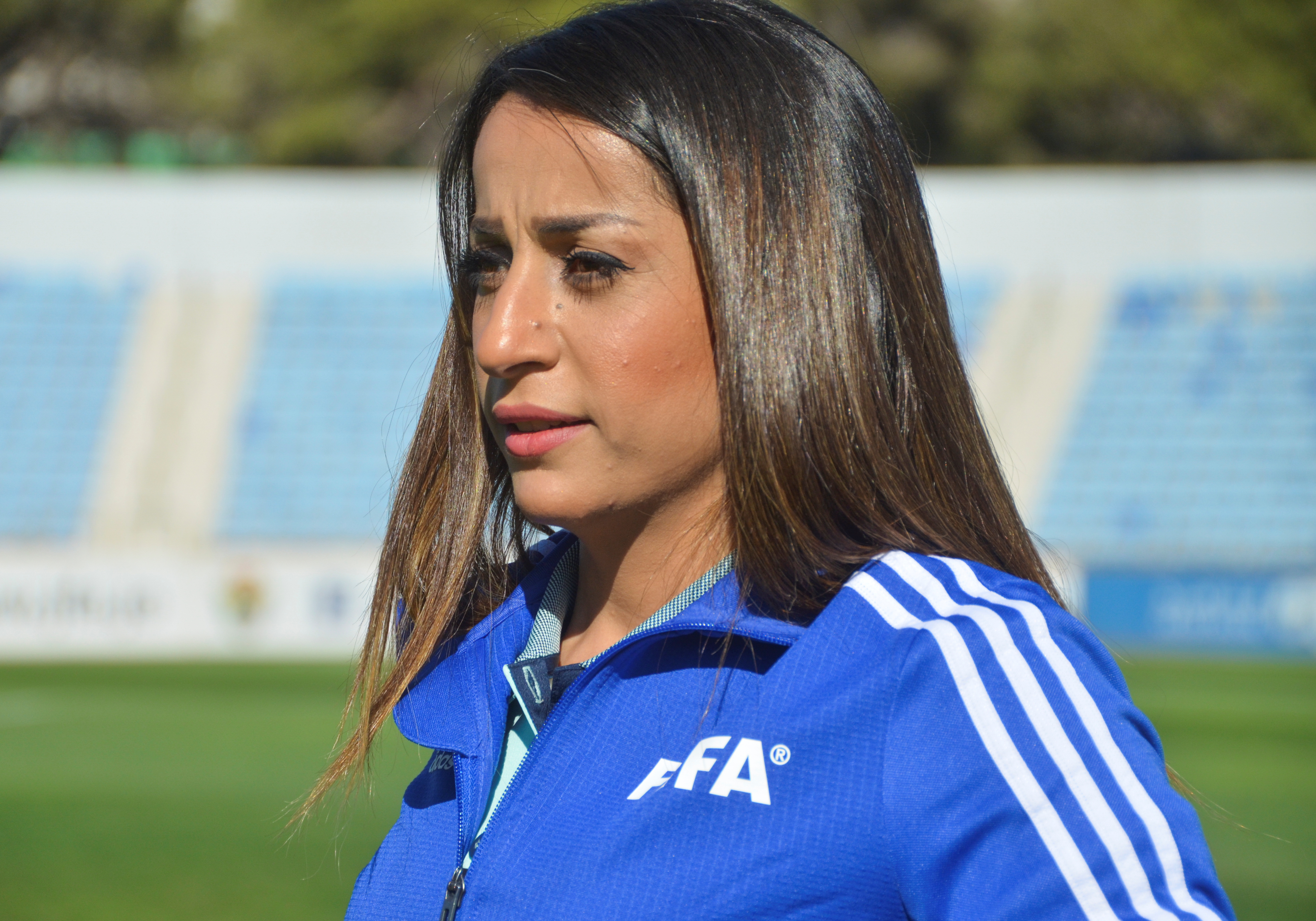 Esra'a al-Mobideen, a Jordanian female referee who was among the first all woman refereeing team to officiate a game at Jordan professional football league, attends an interview with Reuters at Amman International stadium