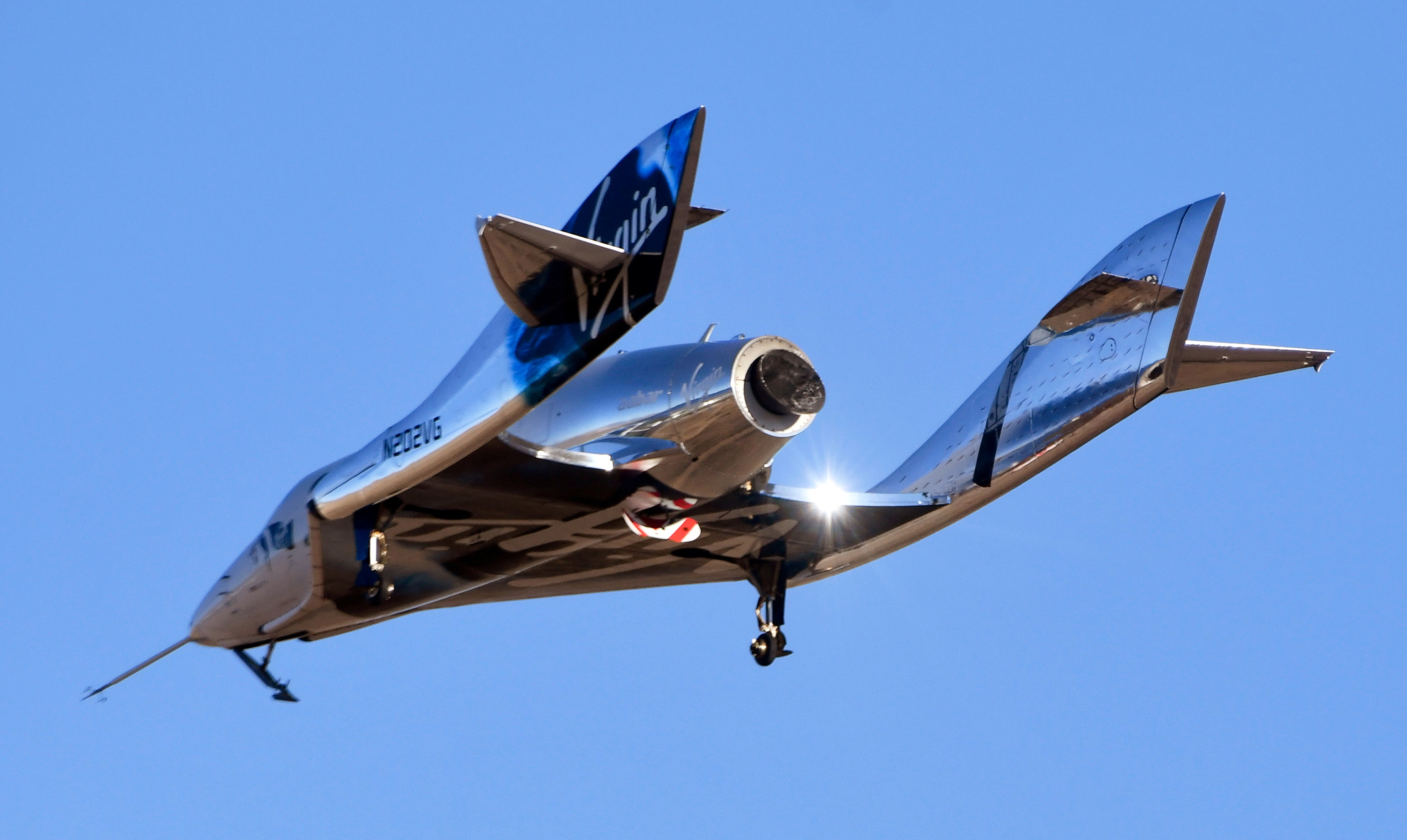 Virgin Galactic’s space tourism rocket plane SpaceShipTwo returns after a test flight  from Mojave Air and Space Port in Mojave