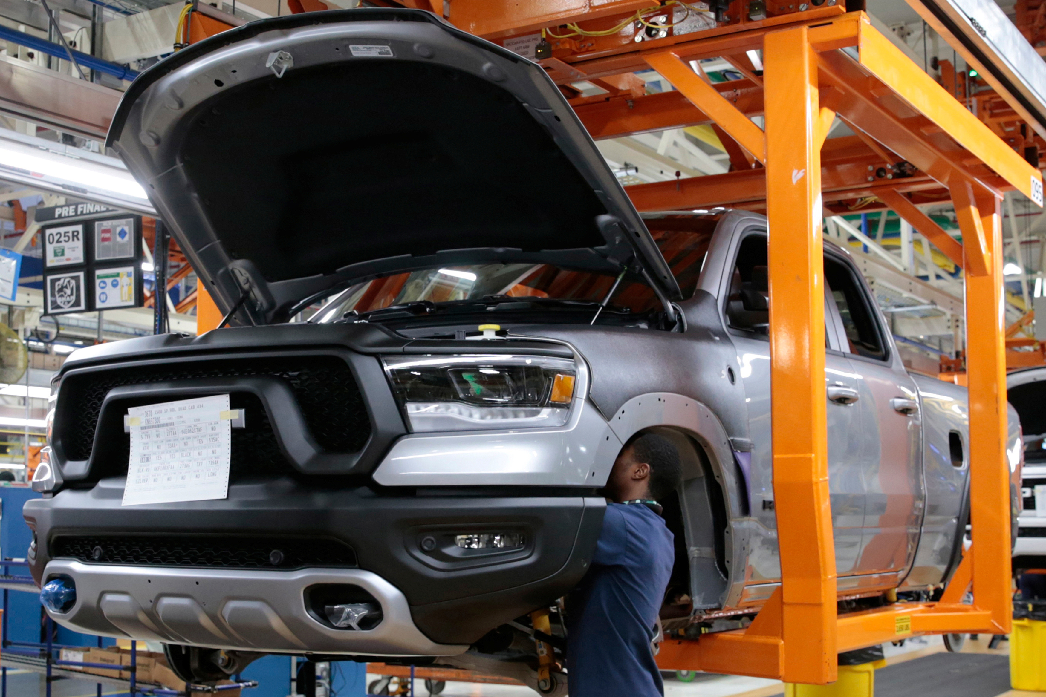 Fiat Chrysler Automobiles assembly workers build 2019 Ram pickup trucks on 'Verticle Adjusting Carriers' at the FCA Sterling Heights Assembly Plant in Sterling Heights Michigan