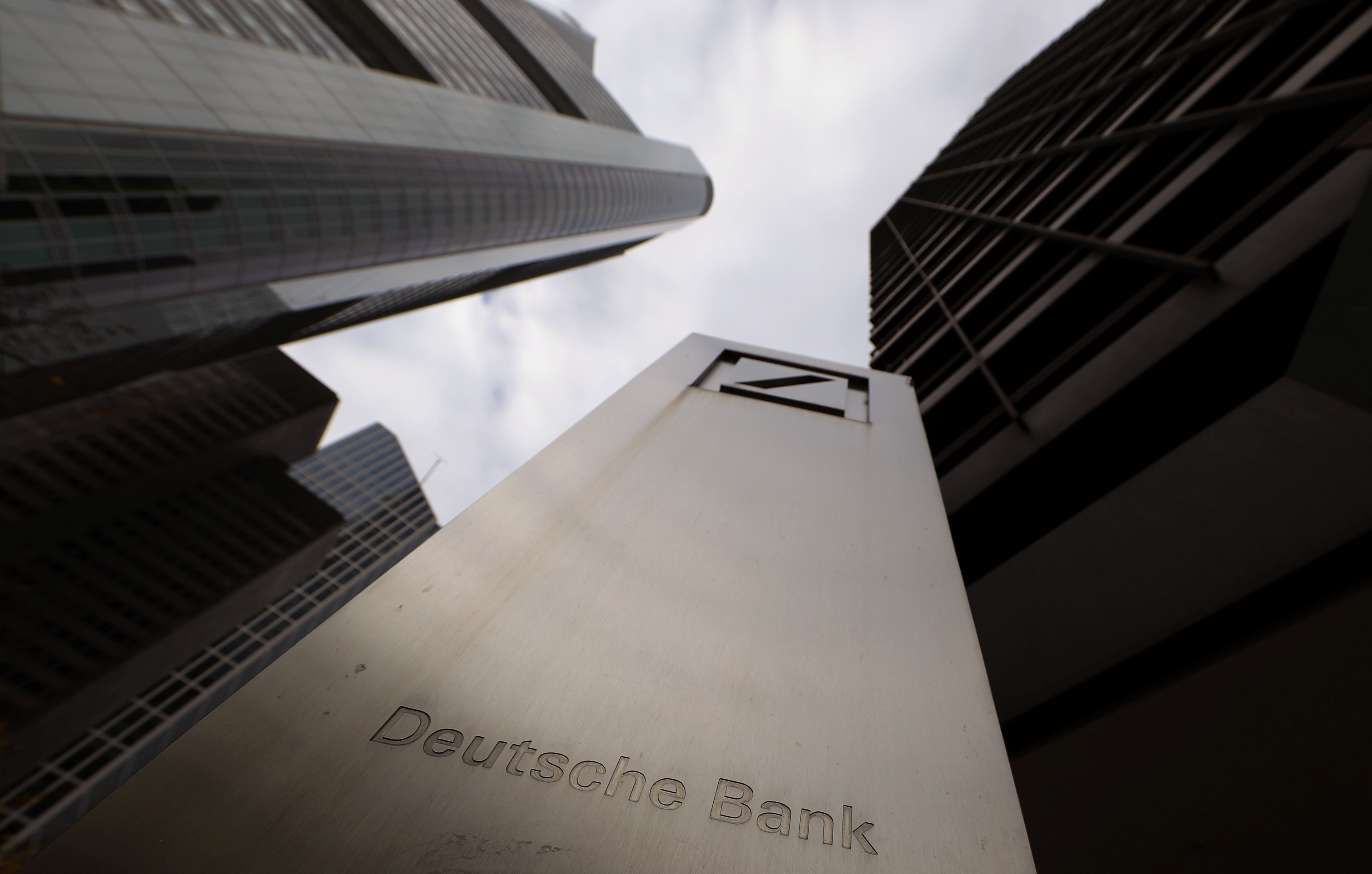 The logo of Deutsche Bank is seen in front of one of the bank's office buildings in Frankfurt