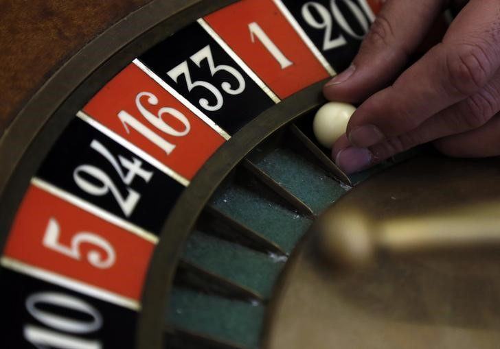 A young croupier trainee turns the roulette at a gaming table at the Cerus Casino Academy in Marseille