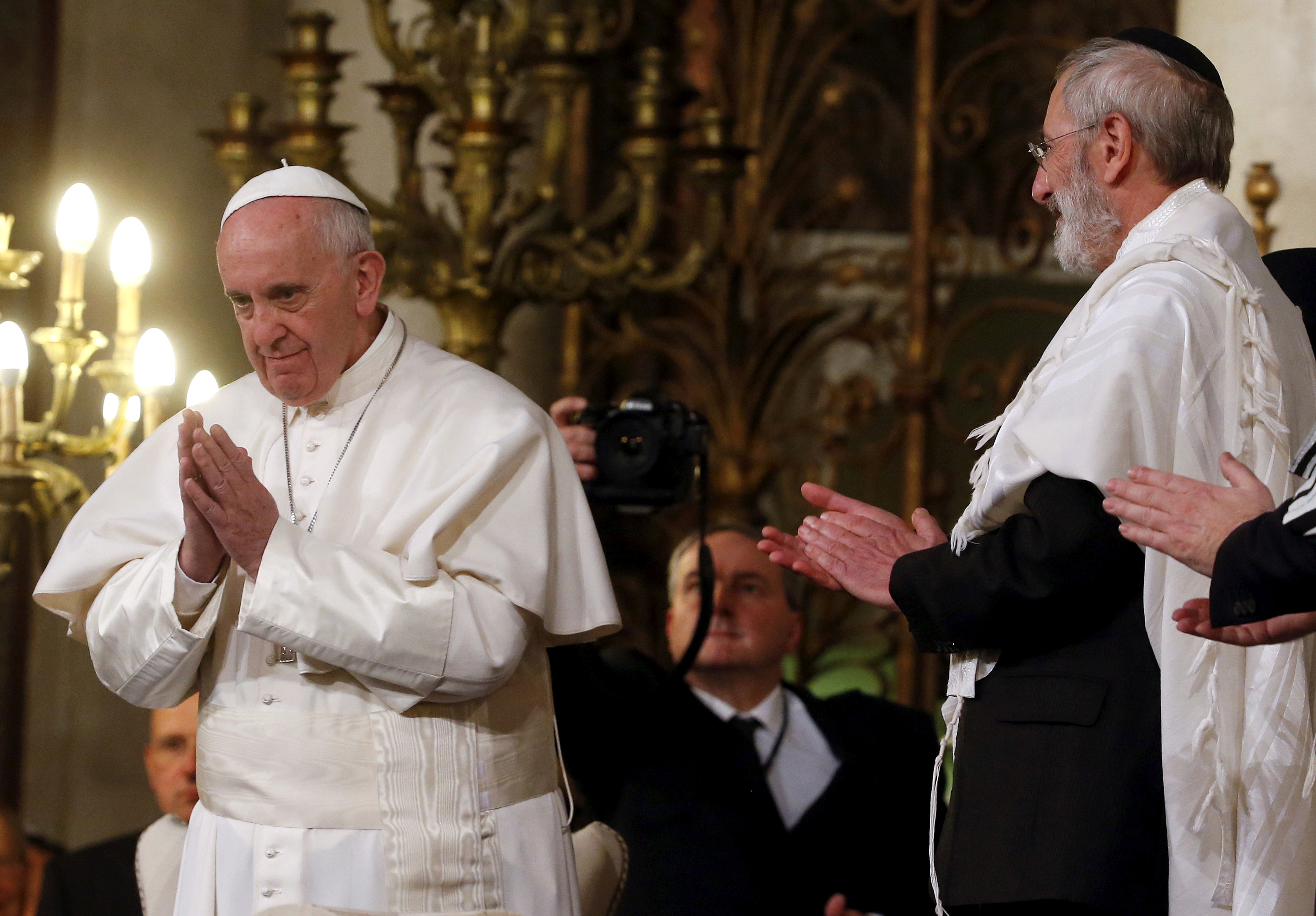Pope Francis gestures at the end of his visit at Rome's Great Synagogue