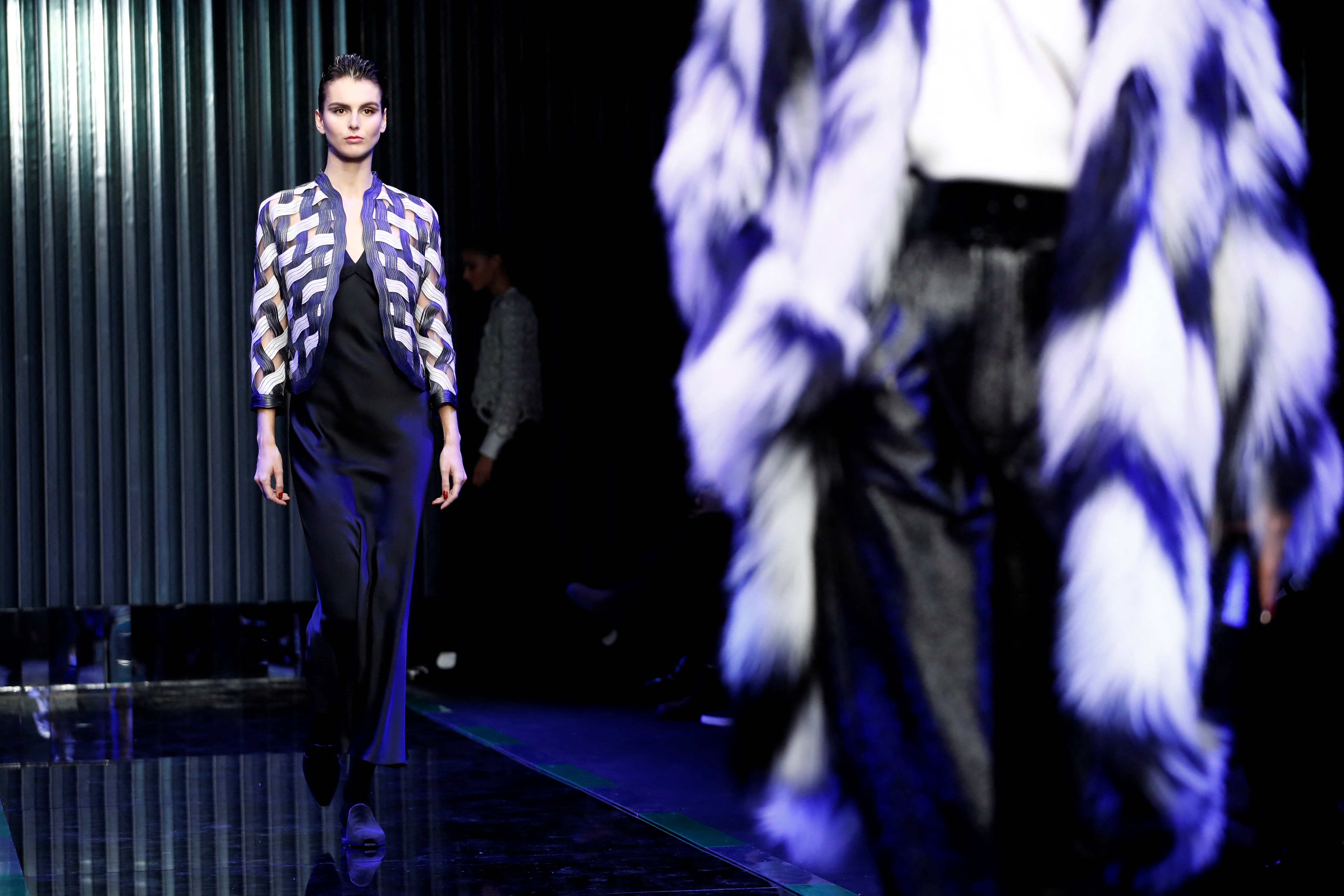 Armani pays tribute to Ukraine suffering with silent show | Reuters