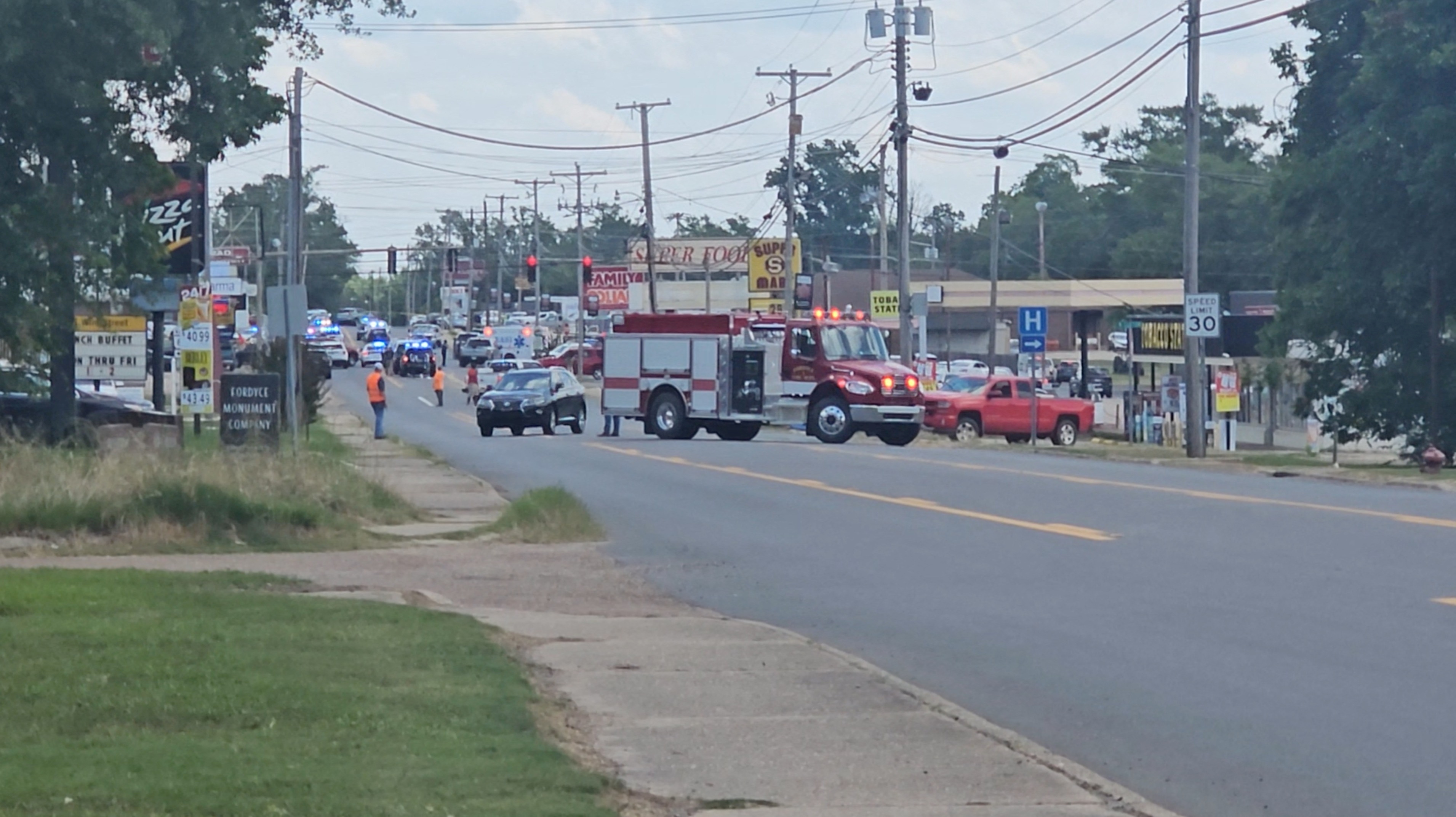 Emergency vehicles are seen at the scene of a shooting incident in Fordyce