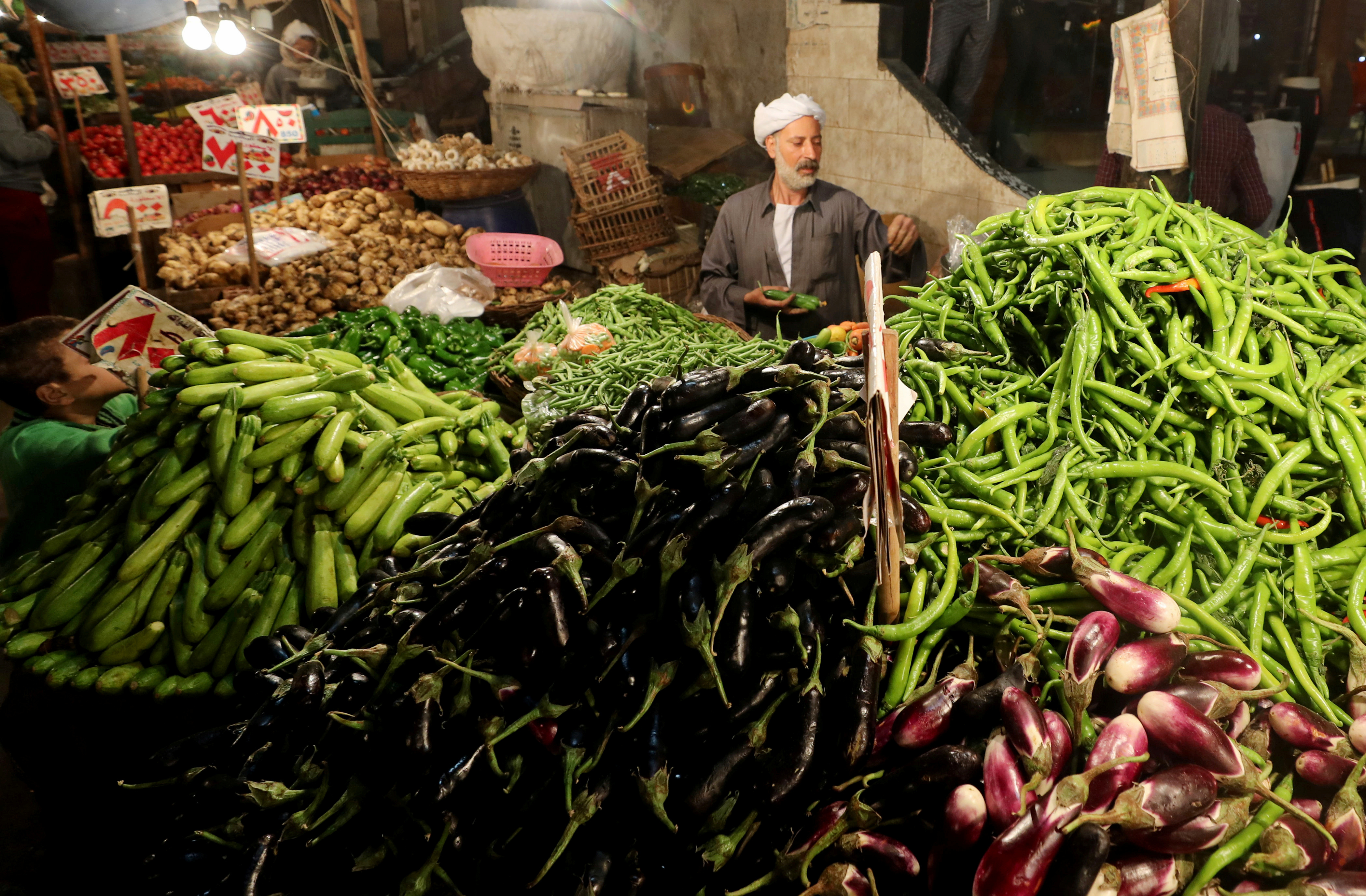 An Egyptian vegetable seller is seen at a market in Cairo