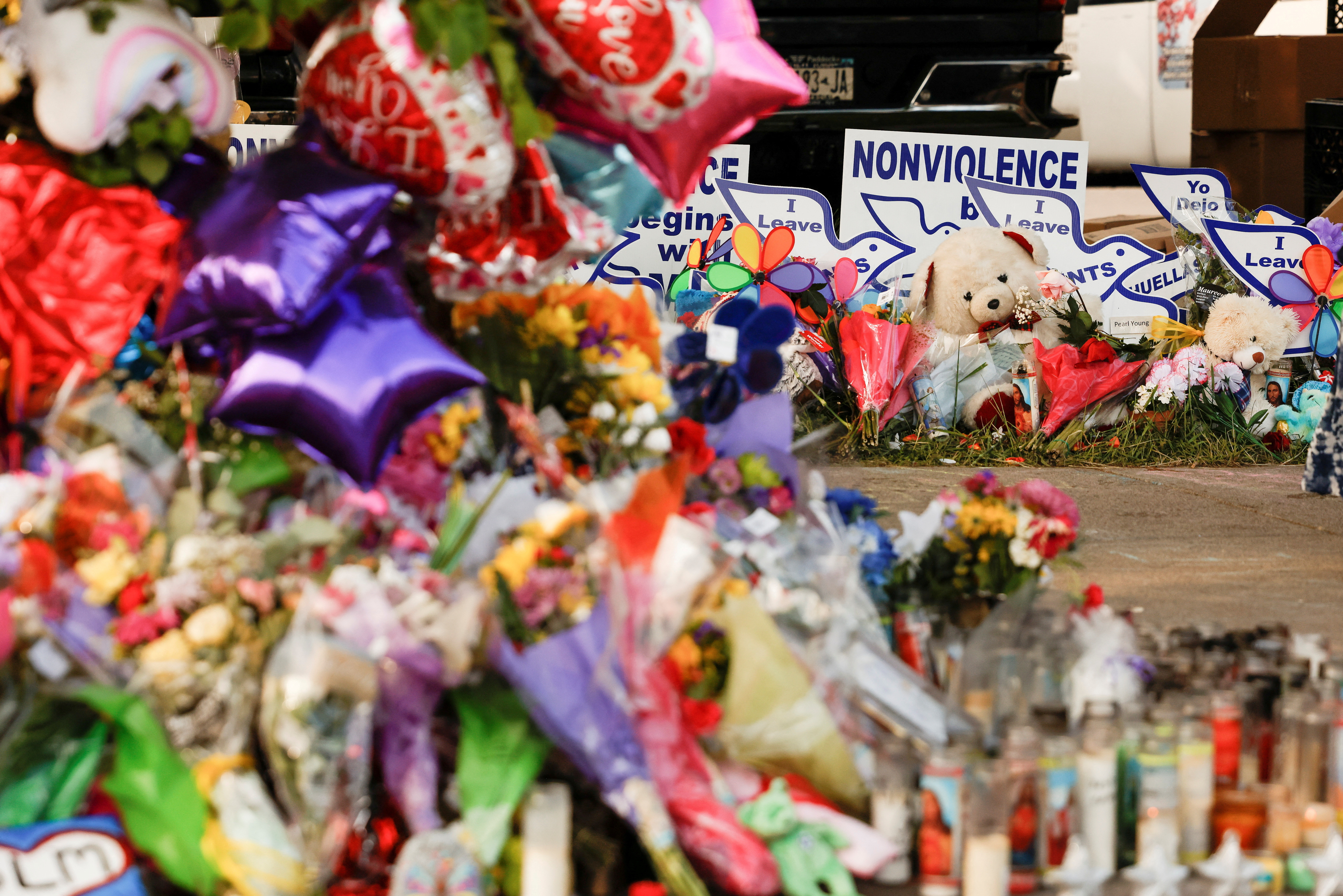 A memorial at the scene of a weekend shooting at a Tops supermarket in Buffalo, New York