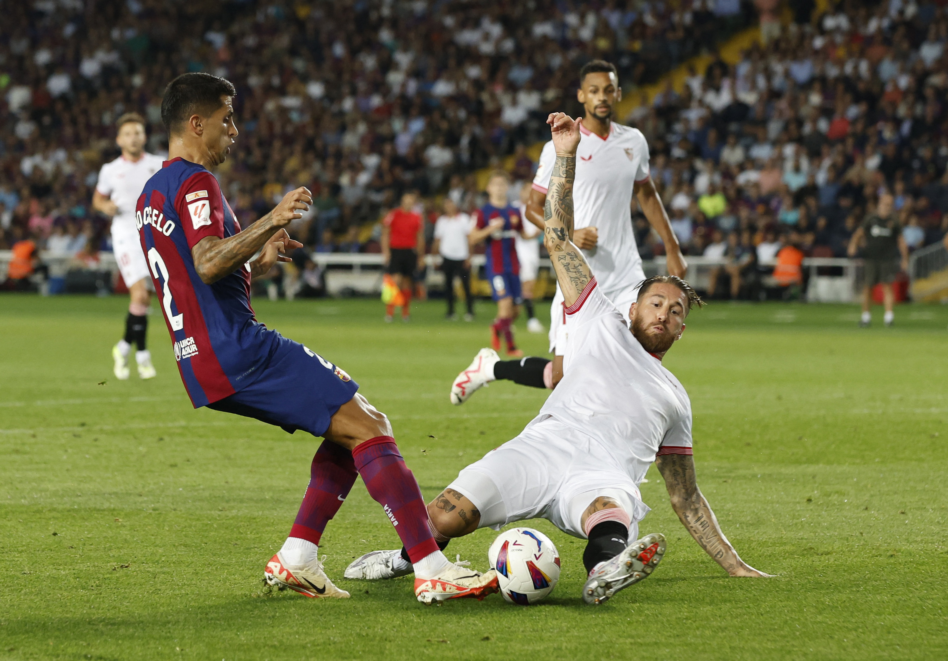 Sergio Ramos' own goal gifts Barcelona victory over Sevilla in La Liga