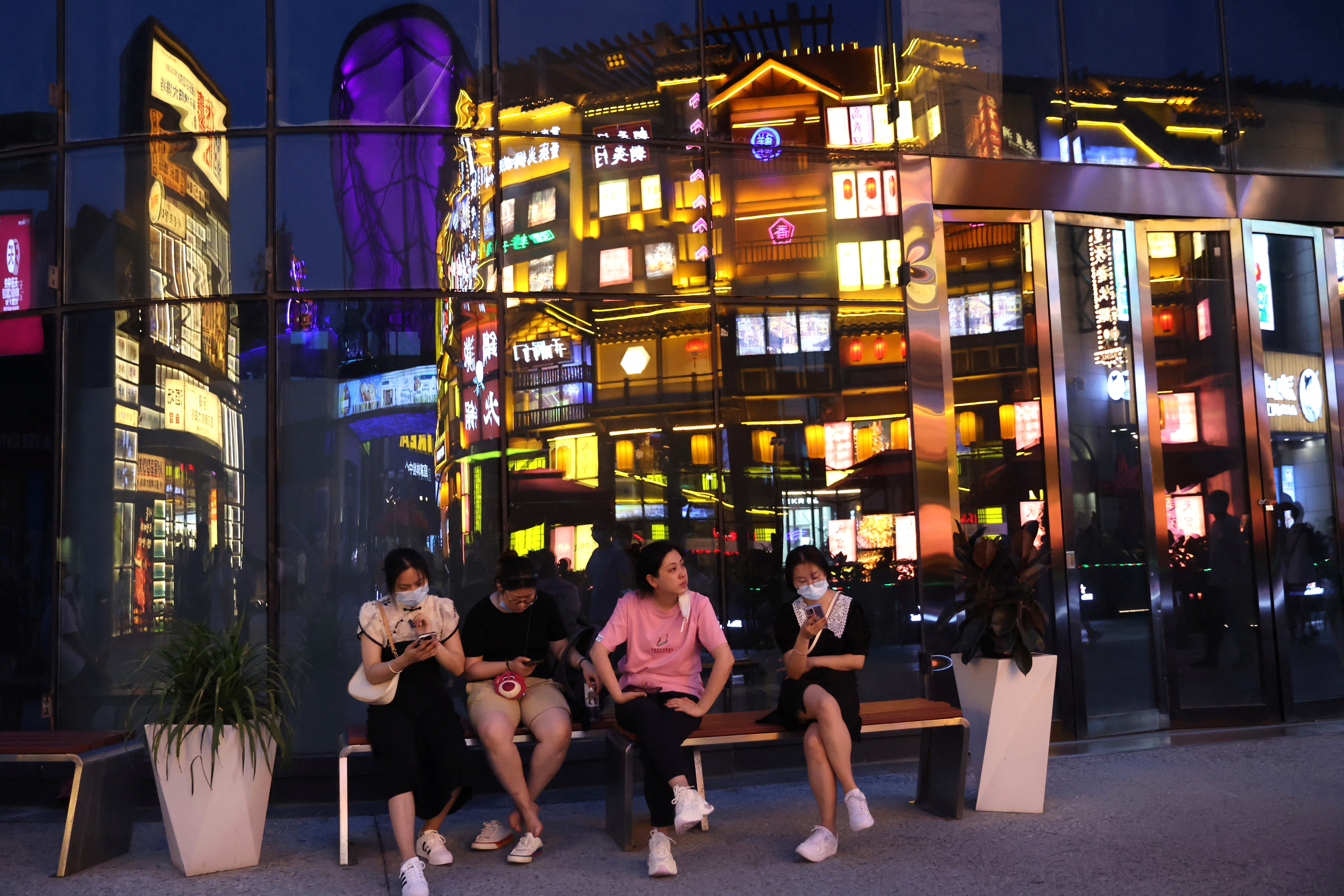 Customers dine at a restaurant at a shopping area in Beijing