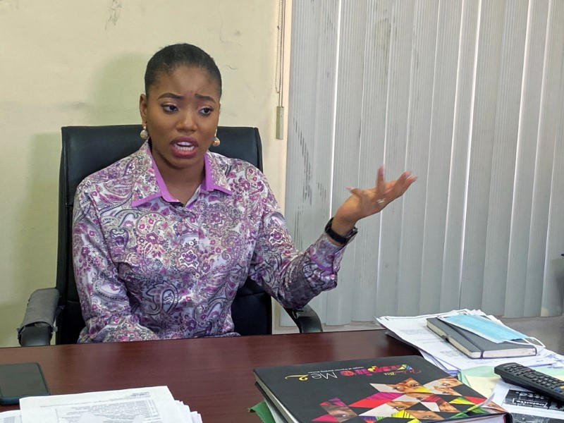 Dumebi Iyeke, a research analyst with Financial Derivatives, speaks during an interview with Reuters at her office in Lagos