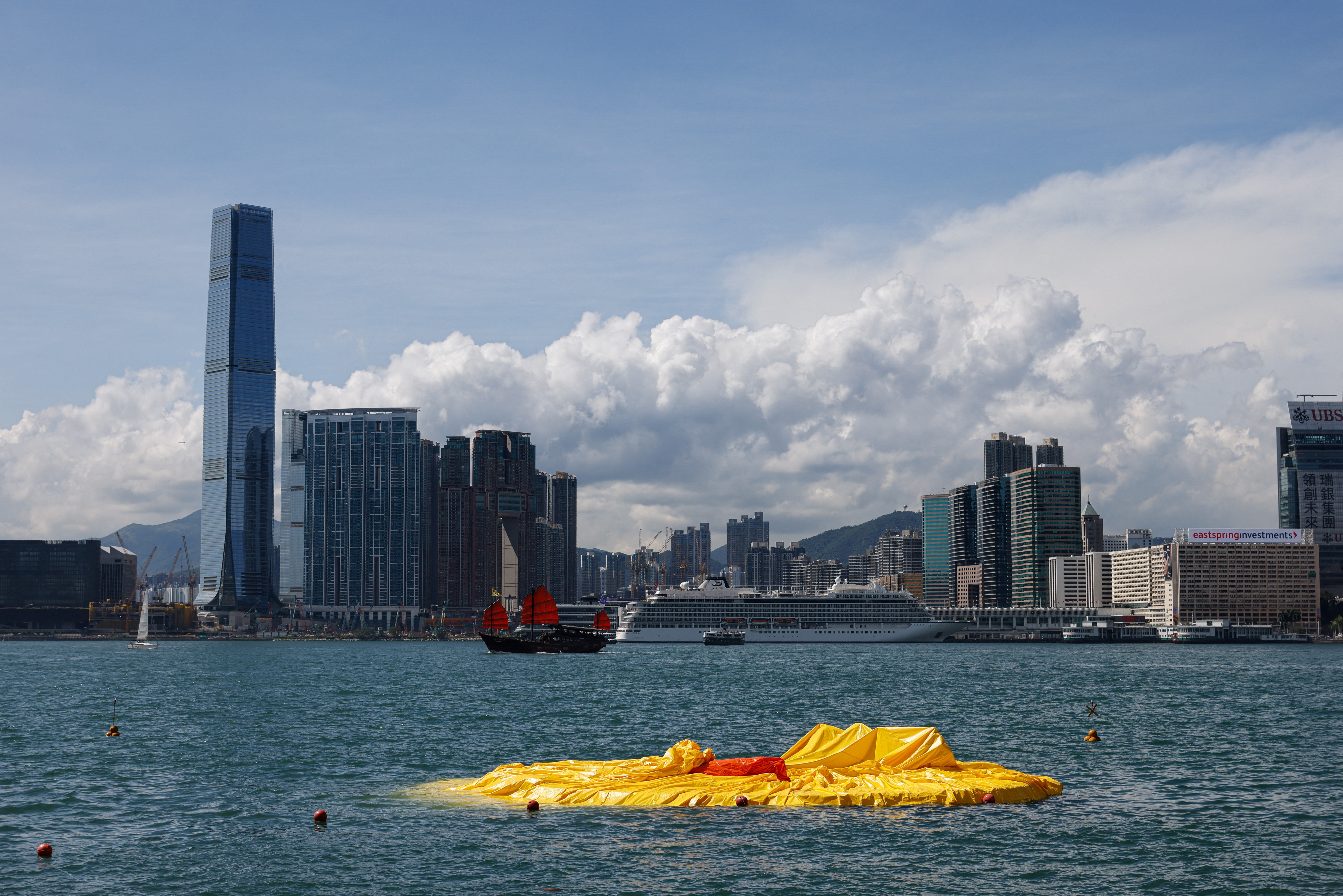 One of the inflatable yellow ducks created by Dutch artist Florentijn Hofman is seen deflated at Victoria Harbour in Hong Kong